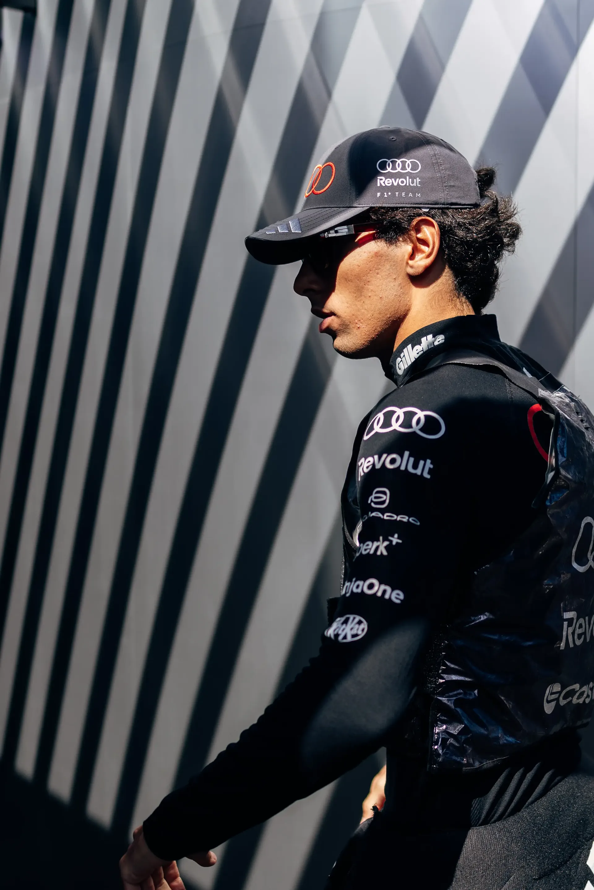 Gabriel Bortoleto of the Audi Revolut F1® Team walking through the paddock.