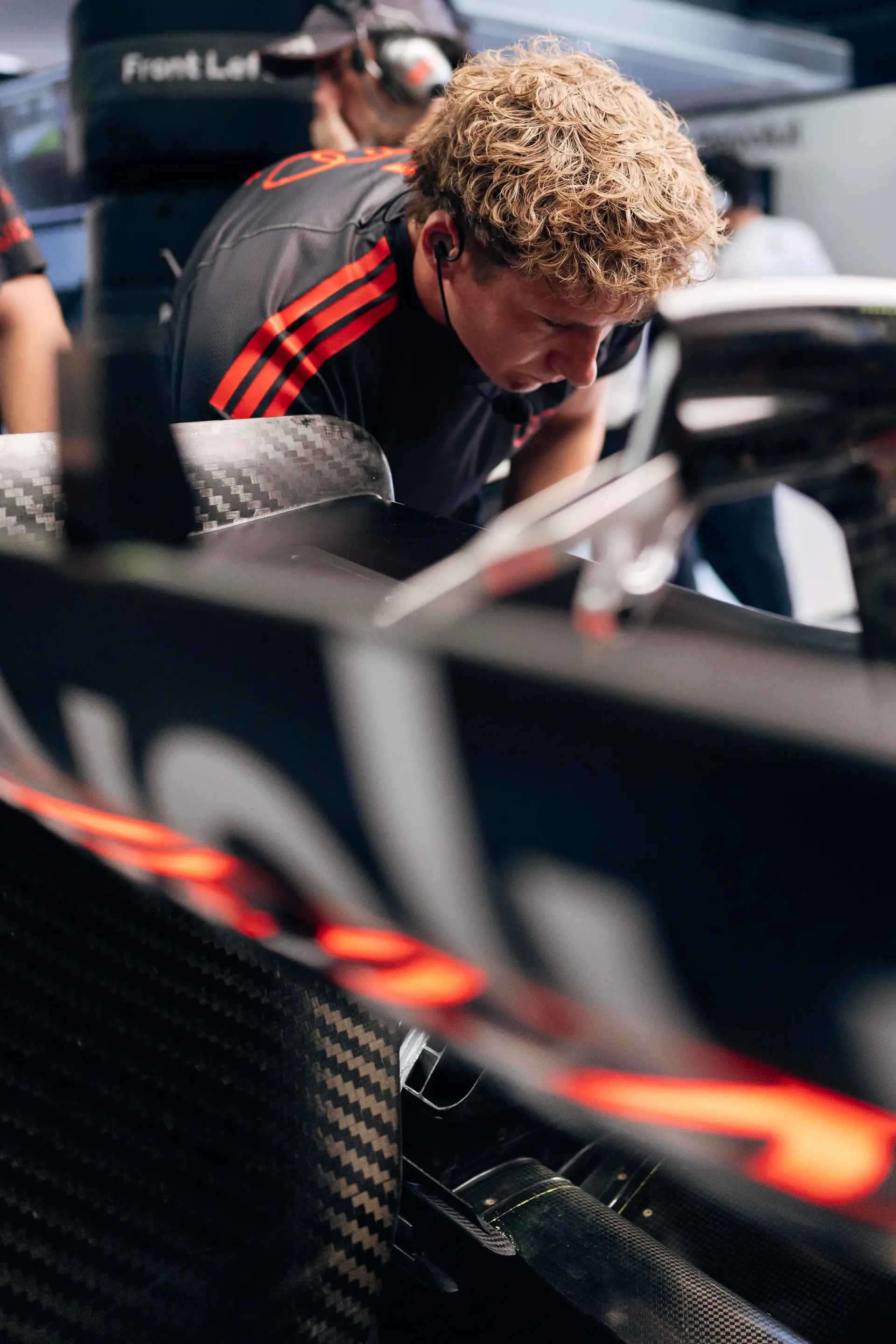 Audi Revolut F1® Team mechanic working on the Formula 1® car in the garage.