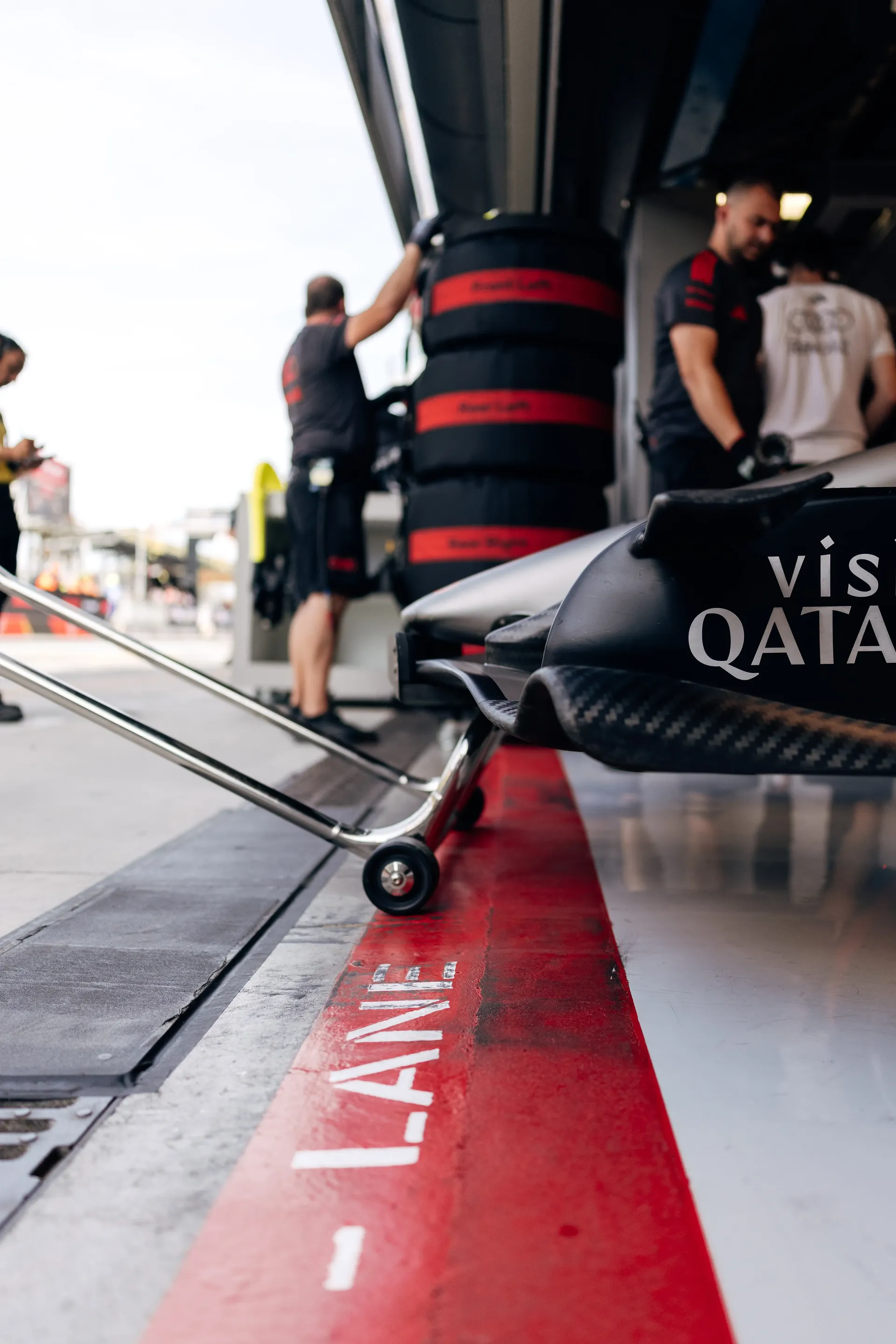 Audi Revolut F1® Team personnel working in the pit lane during the Italian Grand Prix weekend.