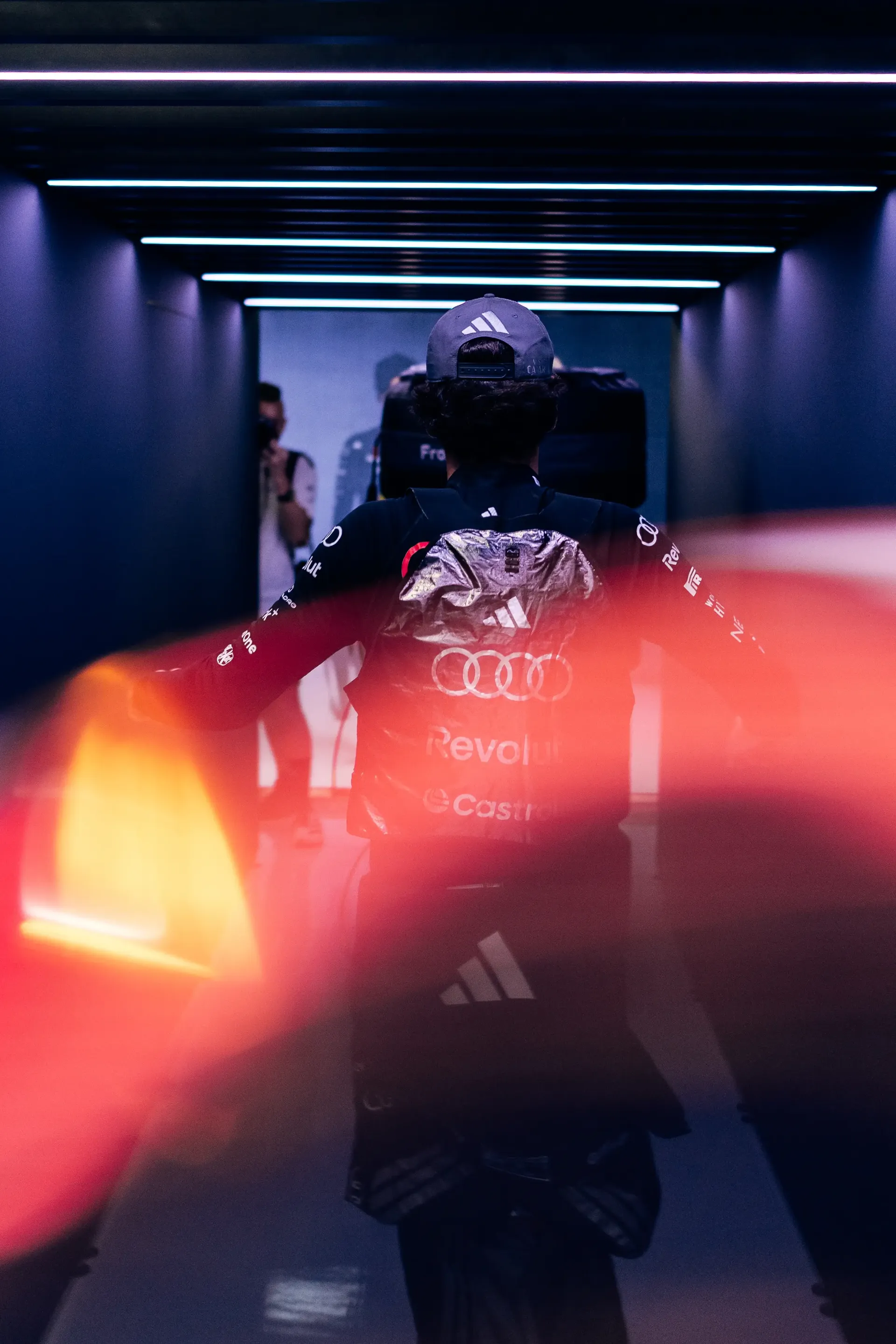 Audi Revolut F1® Team driver Gabriel Bortoleto walks inside the garage