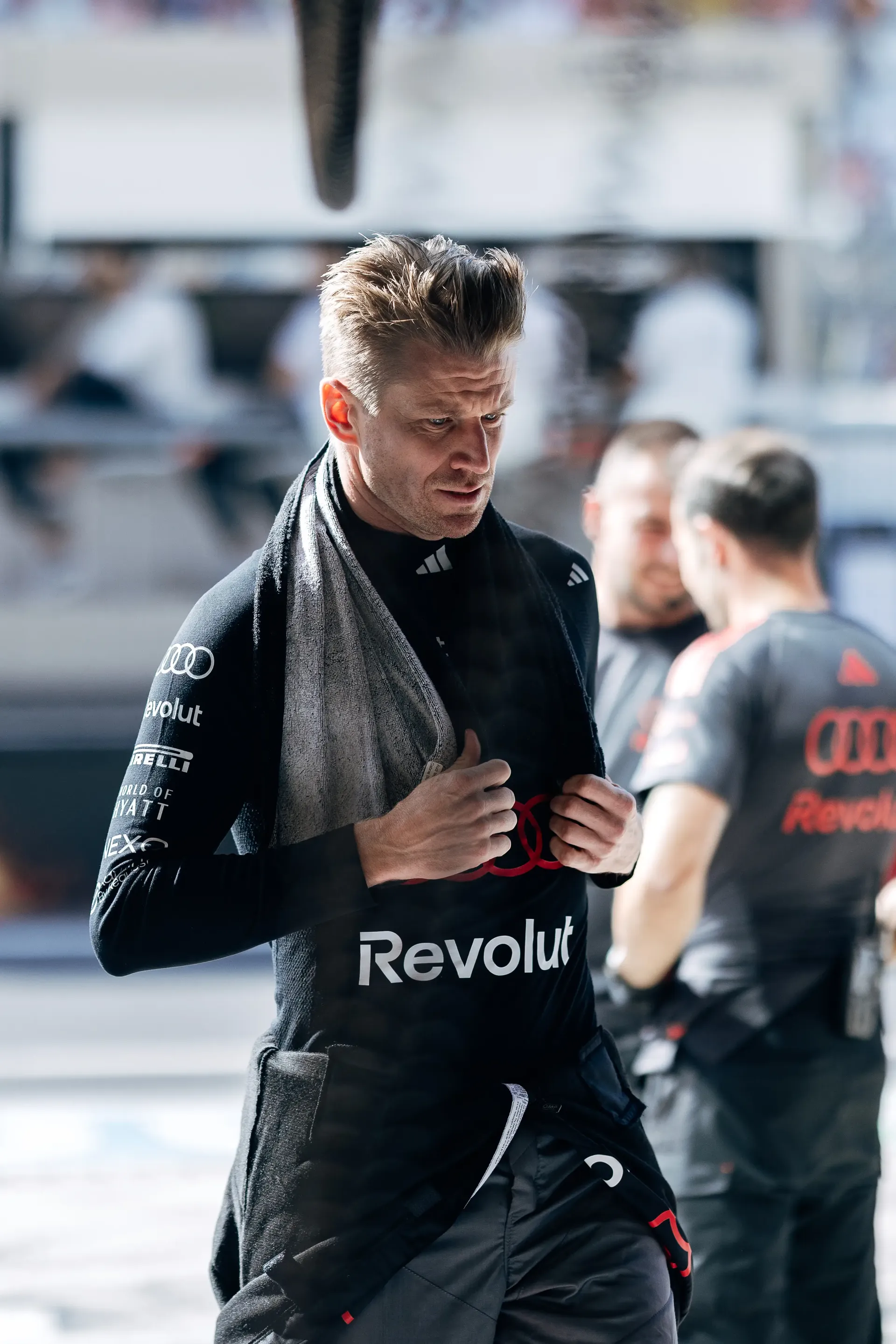 Audi Revolut F1® Team driver Nico Hulkenberg walking through the paddock during qualifying