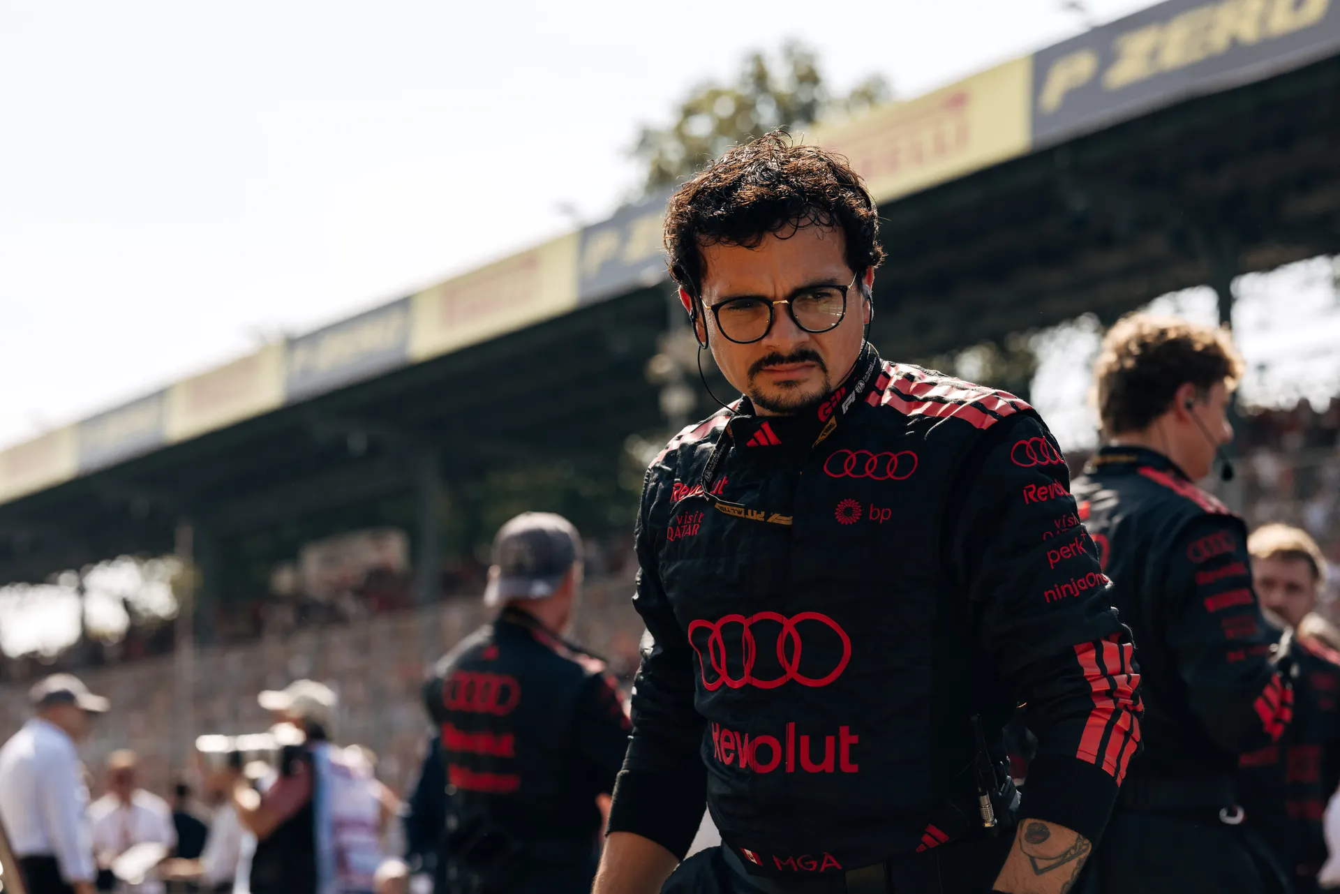 Audi Revolut F1® Team mechanic walking through the Monza paddock