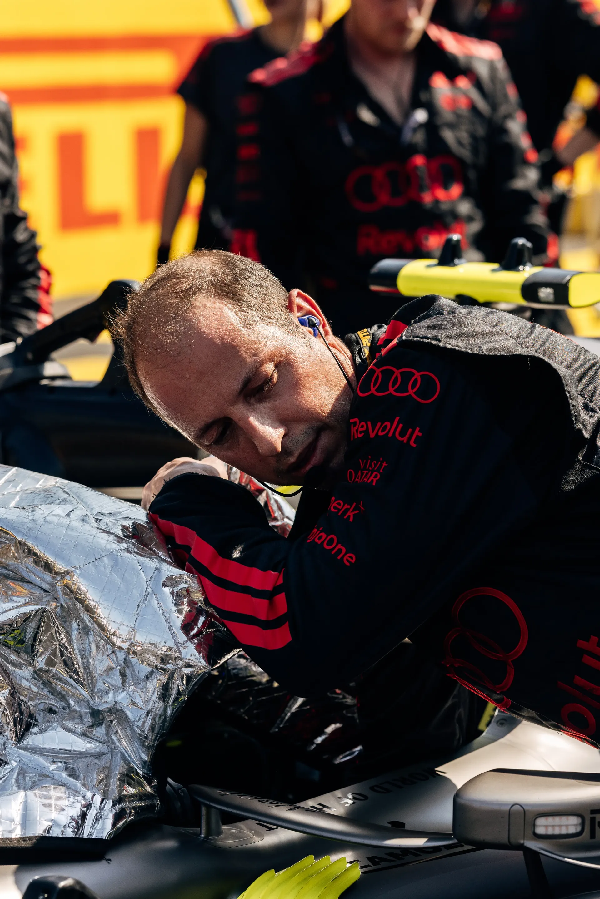 Audi Revolut F1® Team mechanic working on equipment in the garage