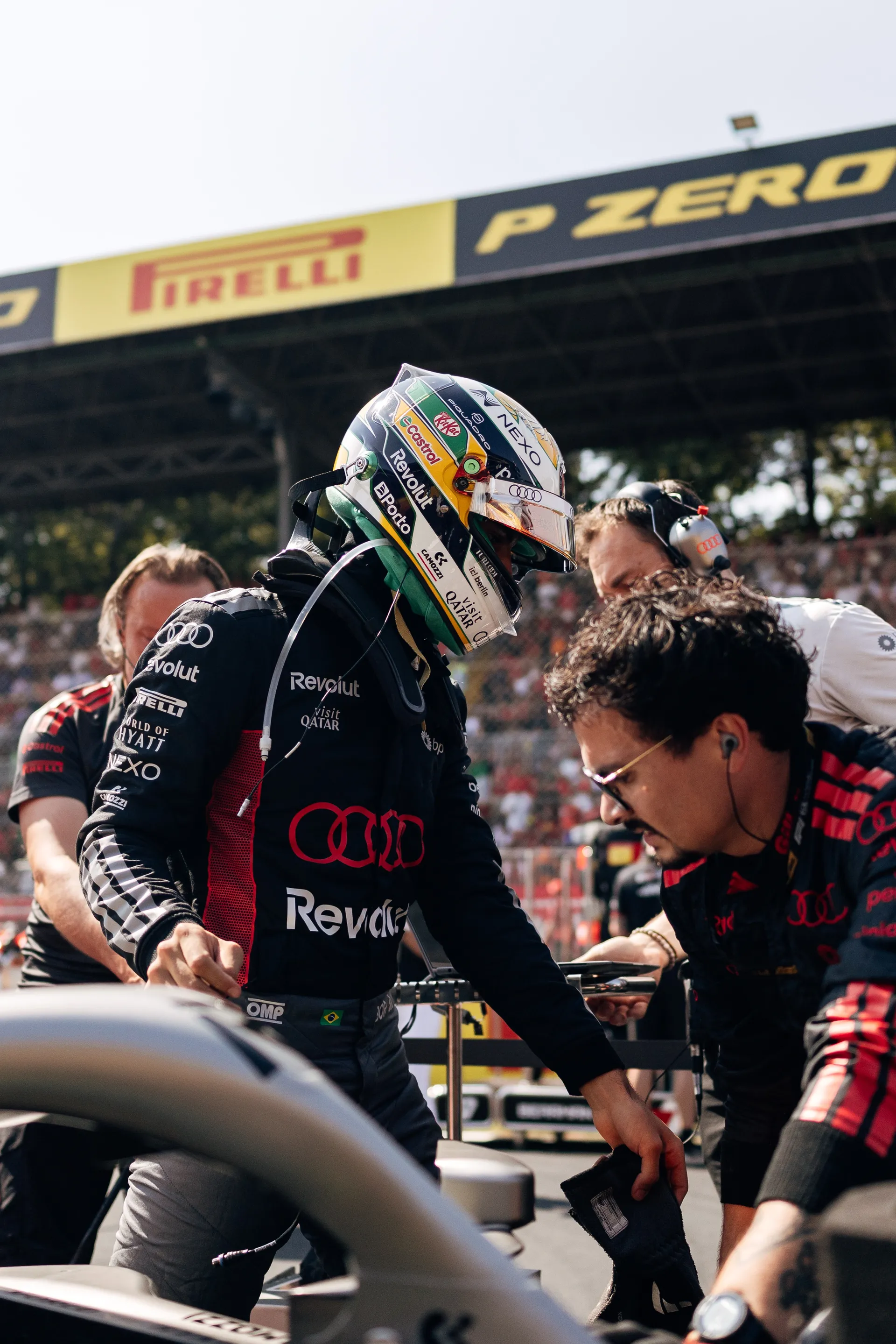 Audi Revolut F1® Team driver Gabriel Bortoleto next to a team mechanic on the race track at the Italian GP 2026 on race day