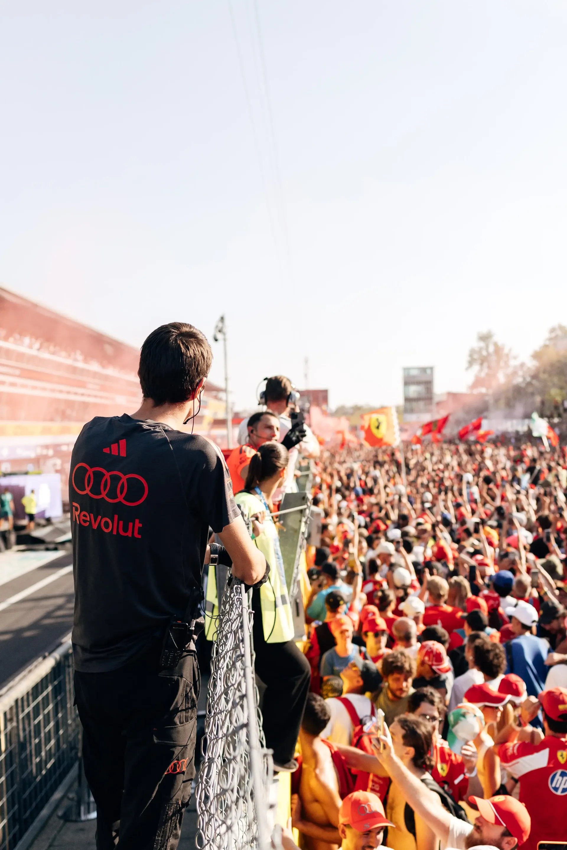 Audi Revolut F1® Team crew at the Italian GP 2026 standing on the paddock surrounded by F1® fans