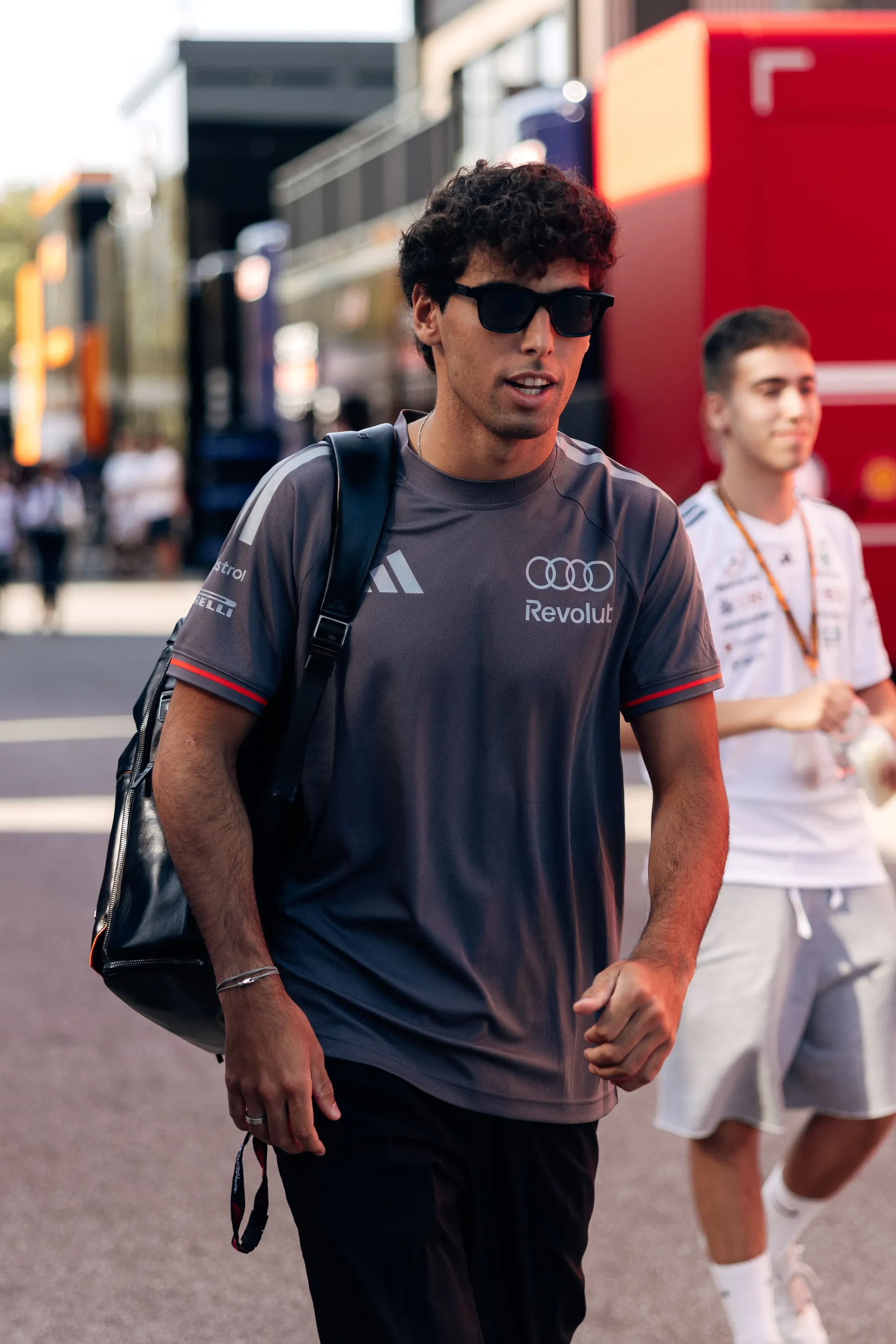 udi Revolut F1® Team driver Gabriel Bortoleto arrives at the Italian Grand Prix on Thursday carrying a black team backpack.