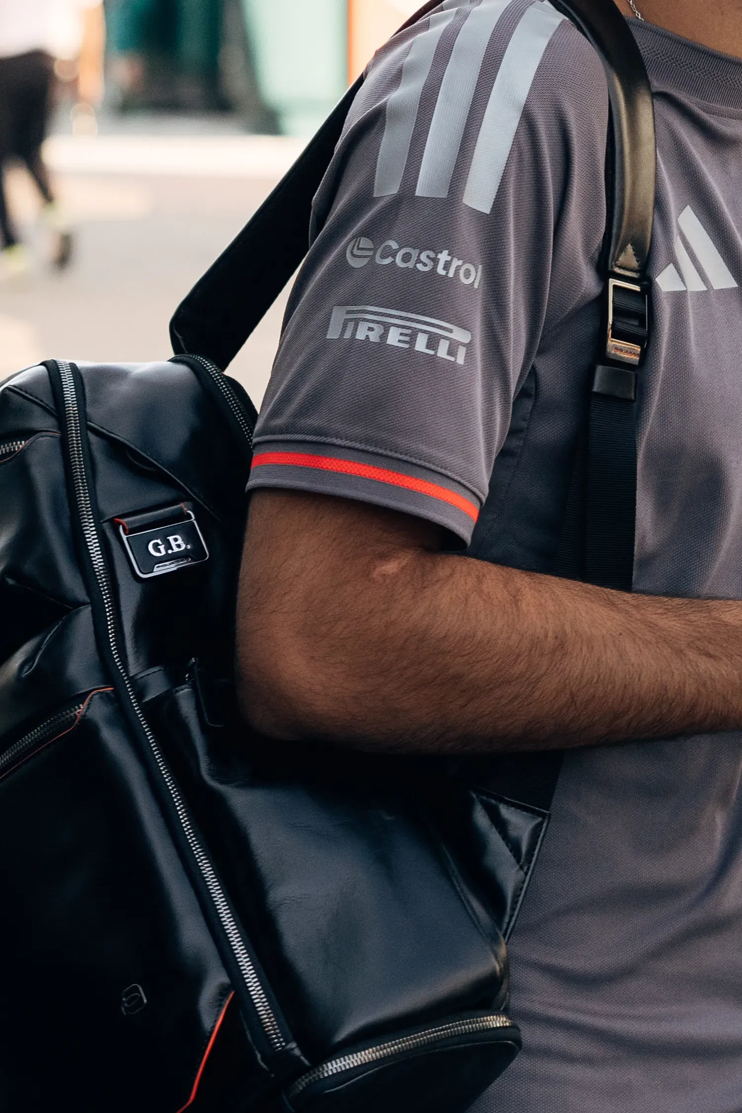 Close-up of Audi Revolut F1® Team driver Gabriel Bortoleto carrying a black team backpack during Thursday arrivals at the Italian Grand Prix.