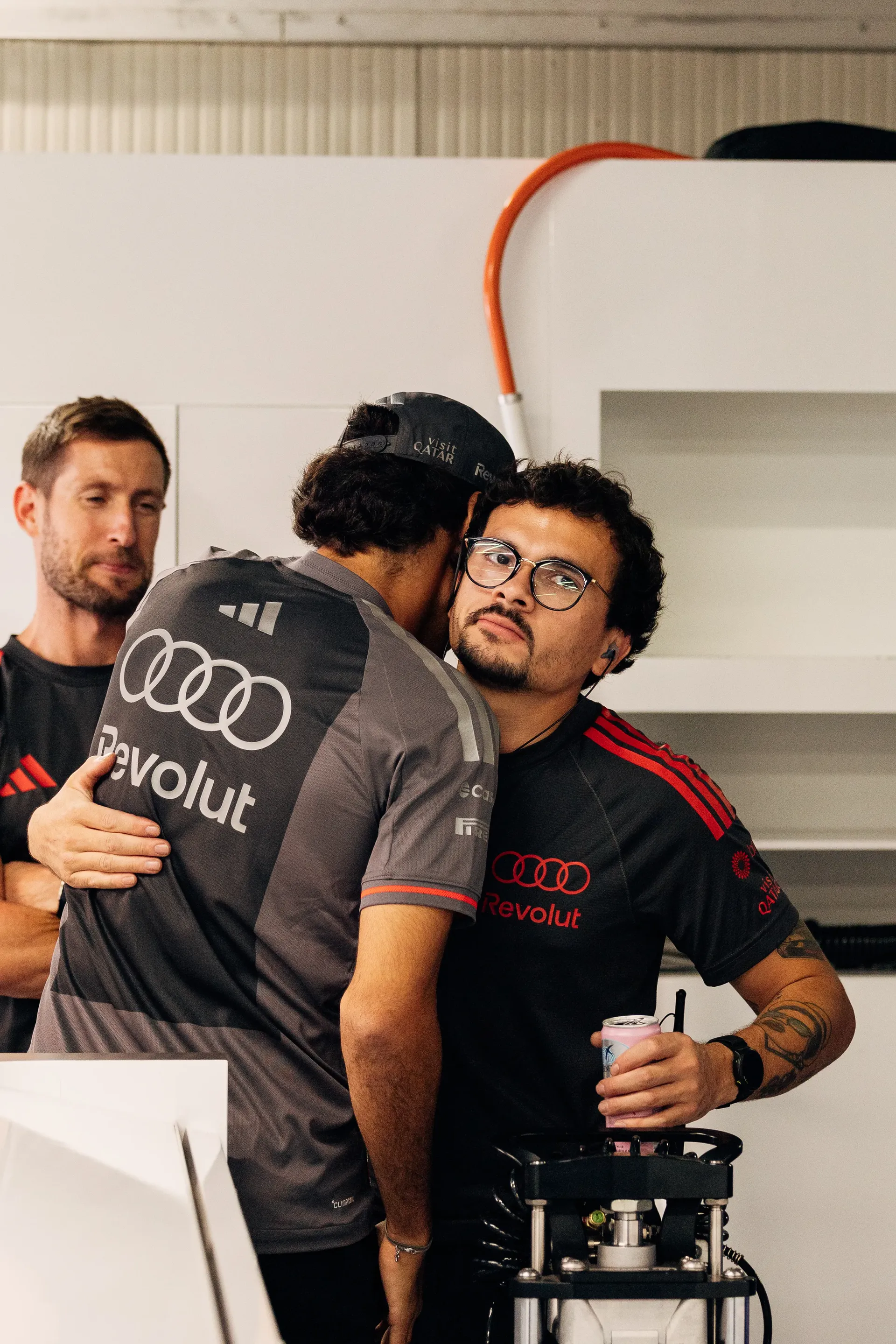 Audi Revolut F1® Team mechanic greeting Gabriel Bortoleto inside the paddock at the Italian Grand Prix.