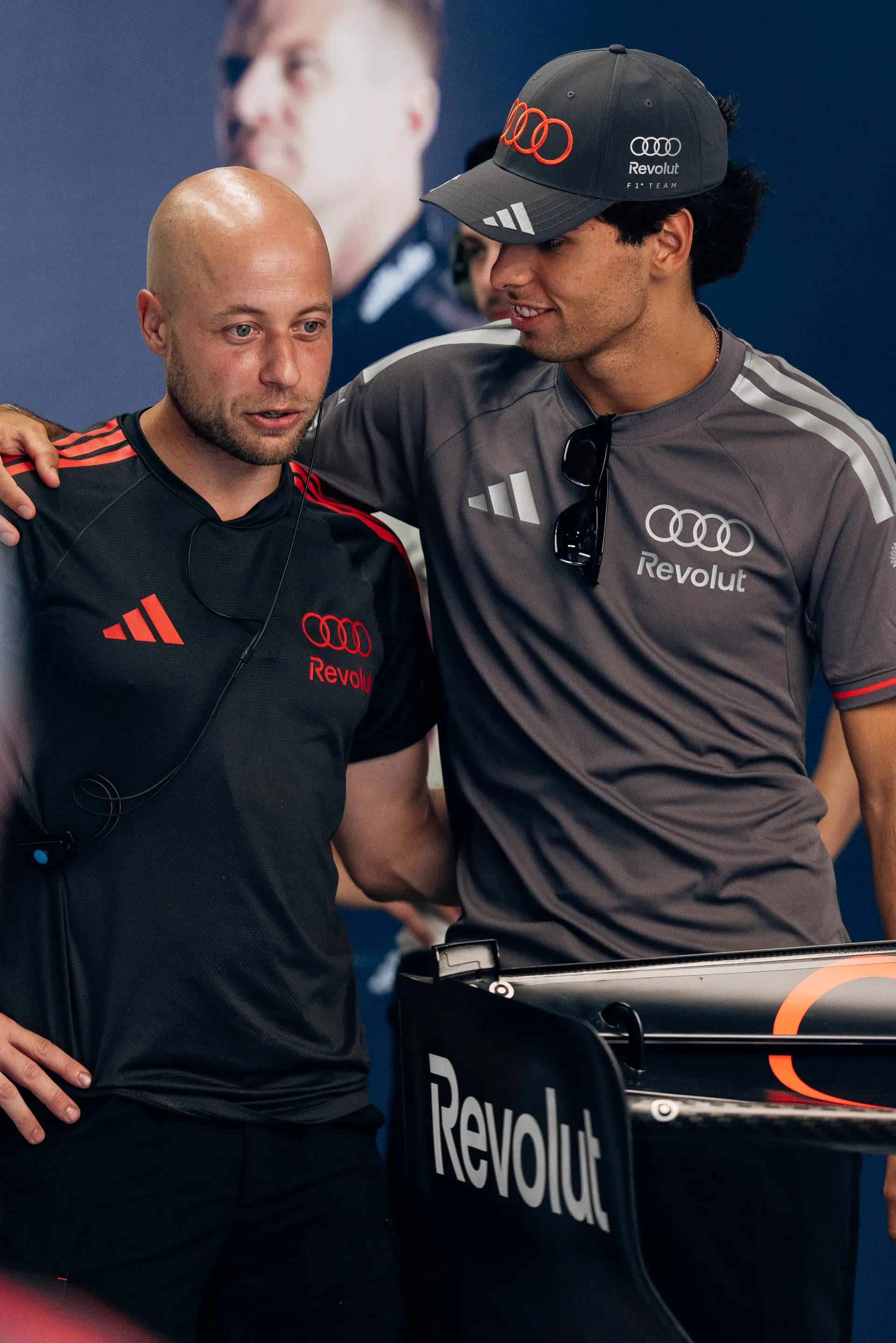 Gabriel Bortoleto walking through the paddock alongside an Audi Revolut F1® Team mechanic at the Italian Grand Prix.