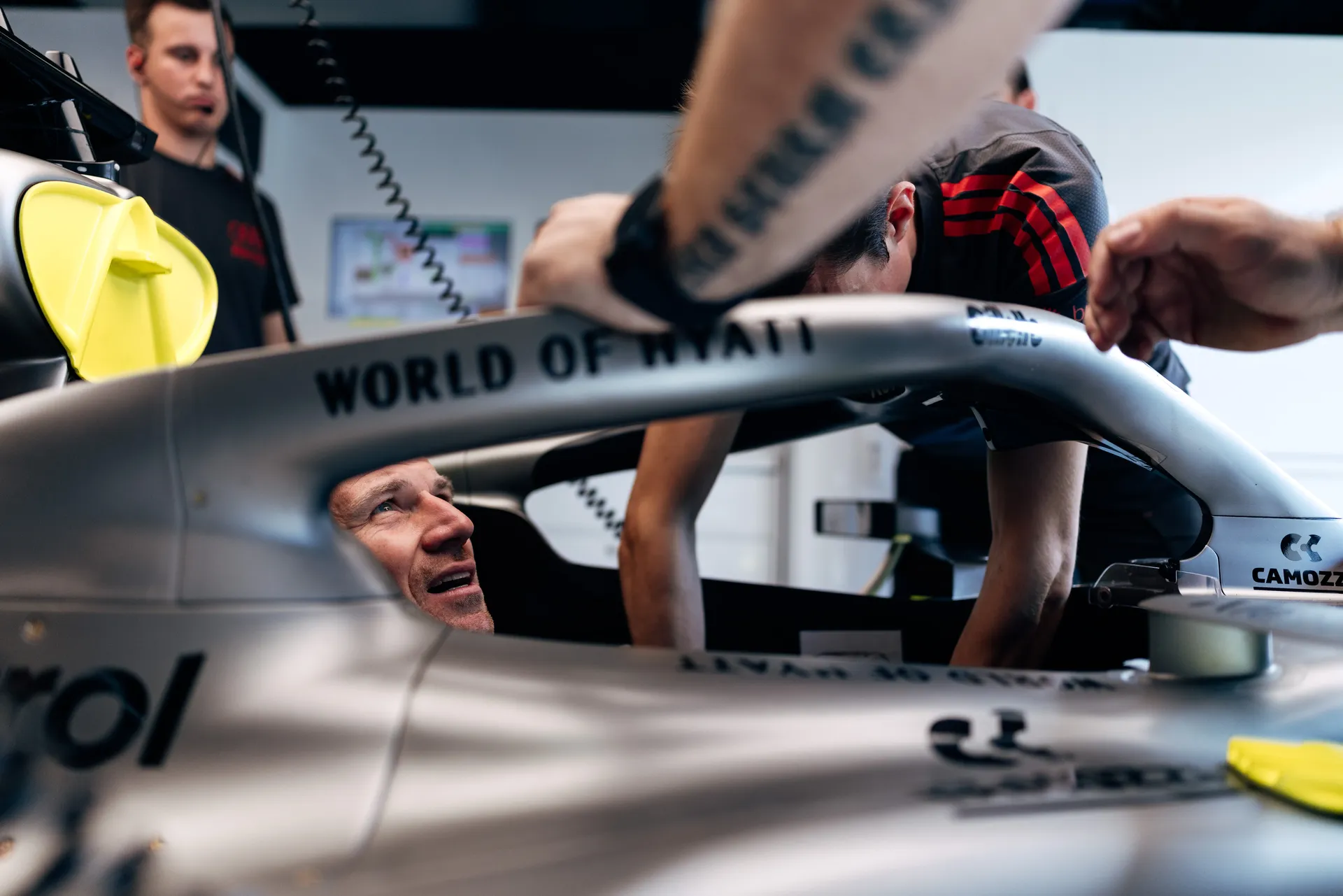 Audi Revolut F1® Team mechanics working on the Formula 1® car inside the garage.