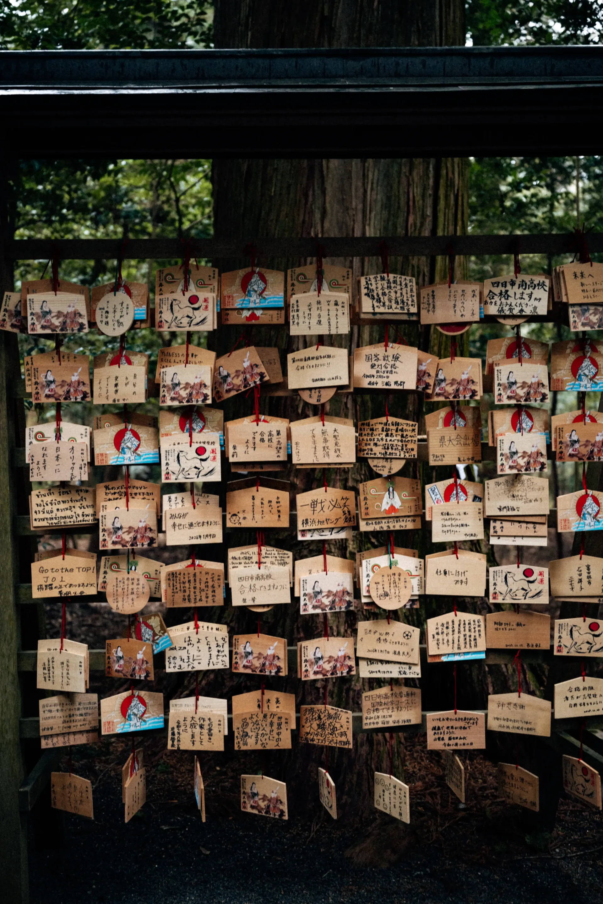 Traditional ema prayer plaques at a Japanese shrine in Suzuka, where visitors leave wishes during the Japanese Grand Prix