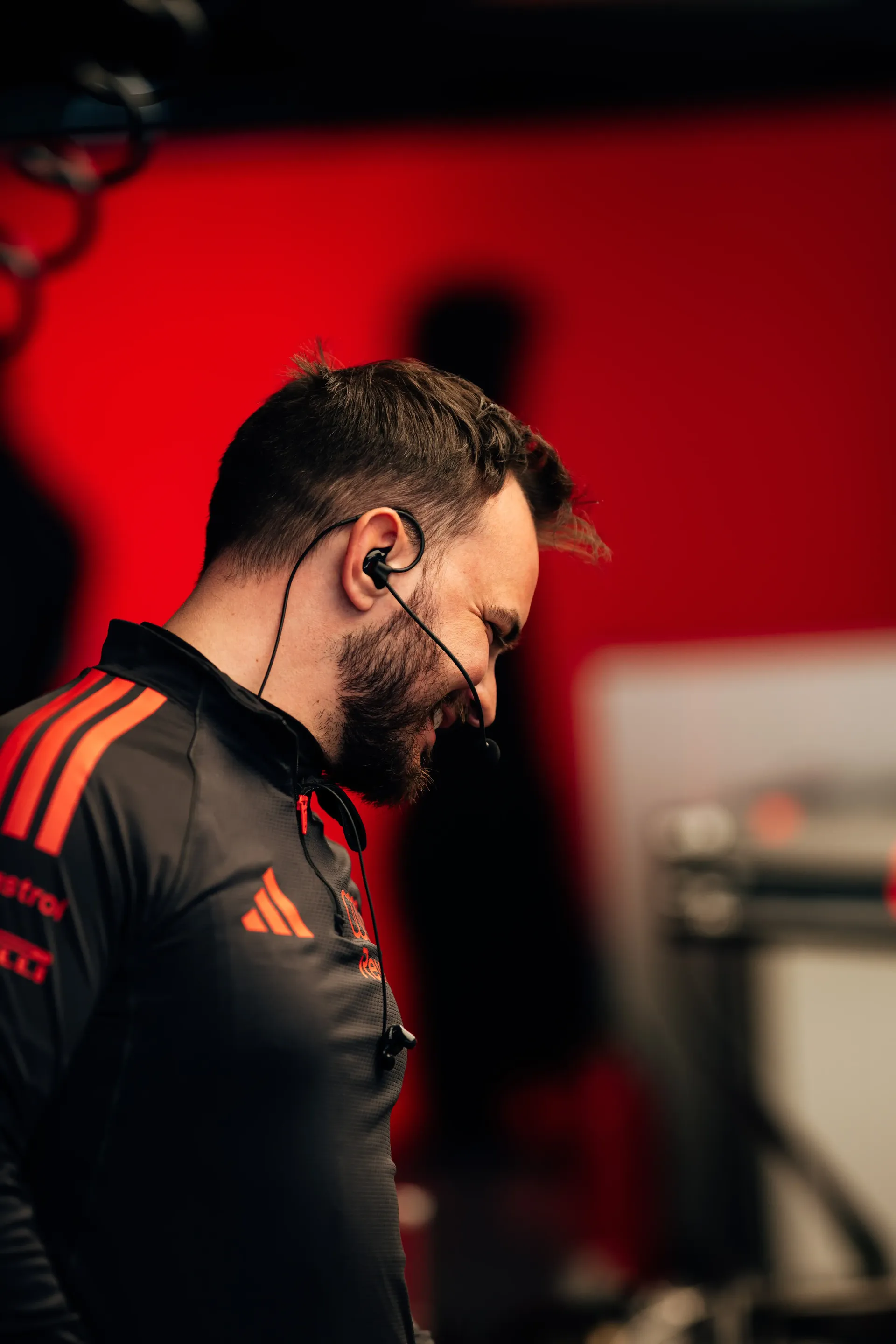 Audi Revolut F1® Team member walking through Suzuka paddock during media day, capturing behind-the-scenes energy ahead of the Japanese Grand Prix F1® weekend.