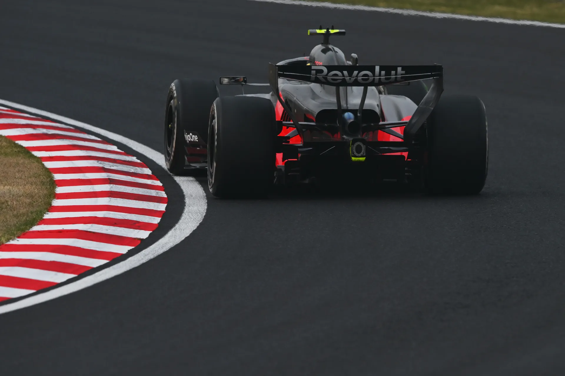 Rear view of an Audi Revolut F1® Team car sweeping through a fast right hand corner at Suzuka during the Japanese Grand Prix.