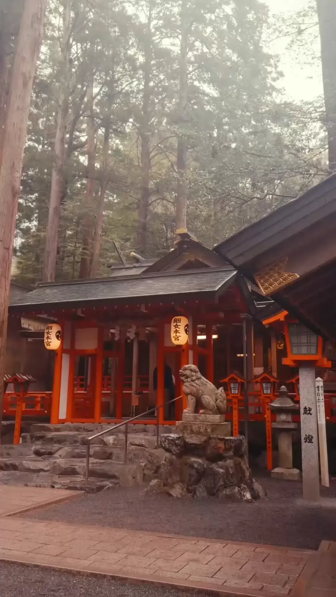 Historic Japanese shrine walkway with red railings and lanterns in Suzuka during the Japanese Grand Prix raceweekend
