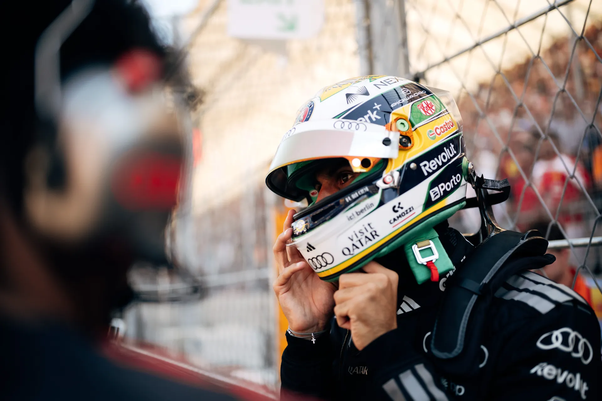Gabriel Bortoleto of the Audi Revolut F1® Team fastening his helmet on the grid in Madrid