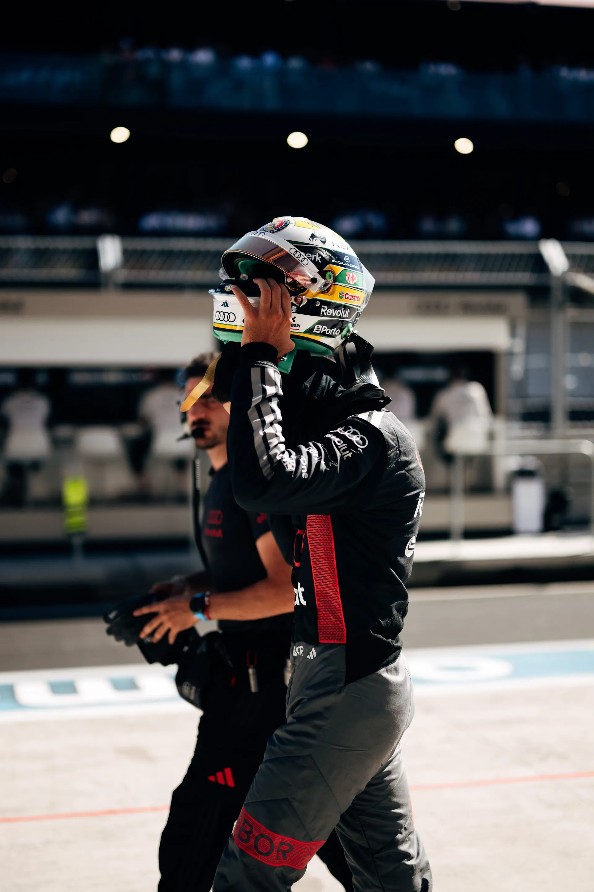 Gabriel Bortoleto of the Audi Revolut F1® Team taking off his helmet in the pit lane in Madrid