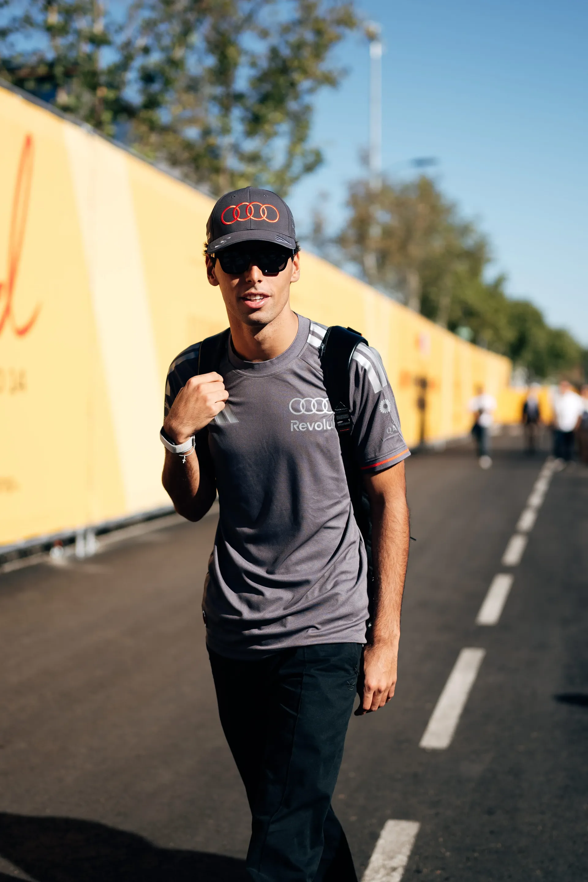 Gabriel Bortoleto of the Audi Revolut F1® Team walking along the track wall in Madrid