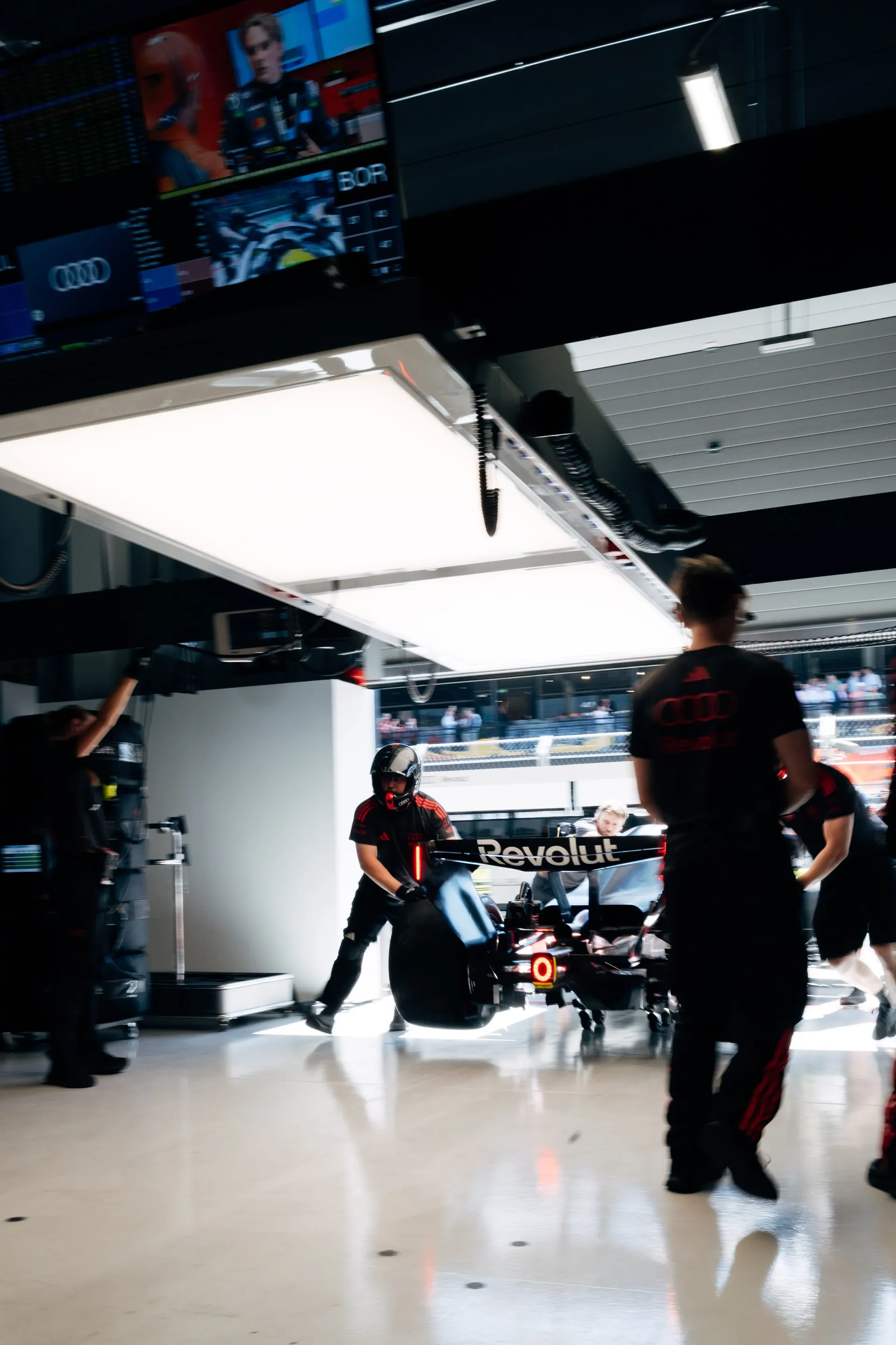 Audi Revolut F1® Team crew releasing Gabriel Bortoleto's car from the garage in Madrid