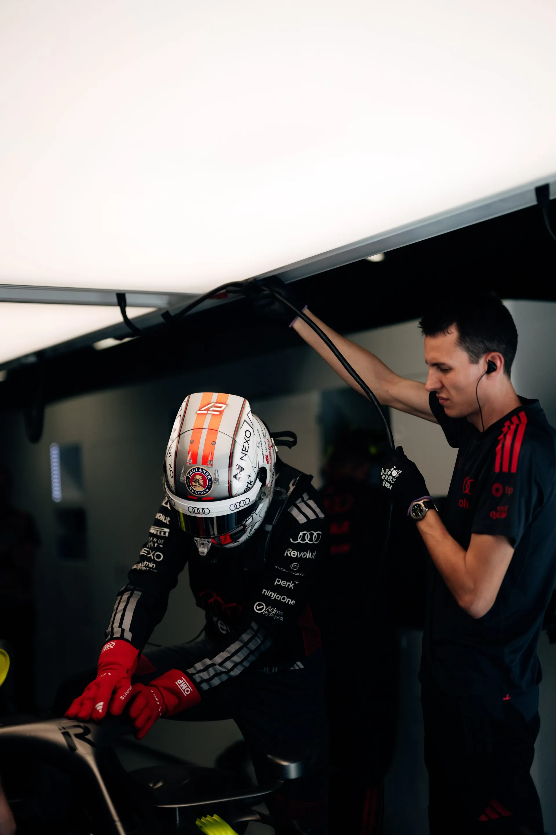 Nico Hulkenberg climbing out of the Audi Revolut F1® Team car in the garage in Madrid