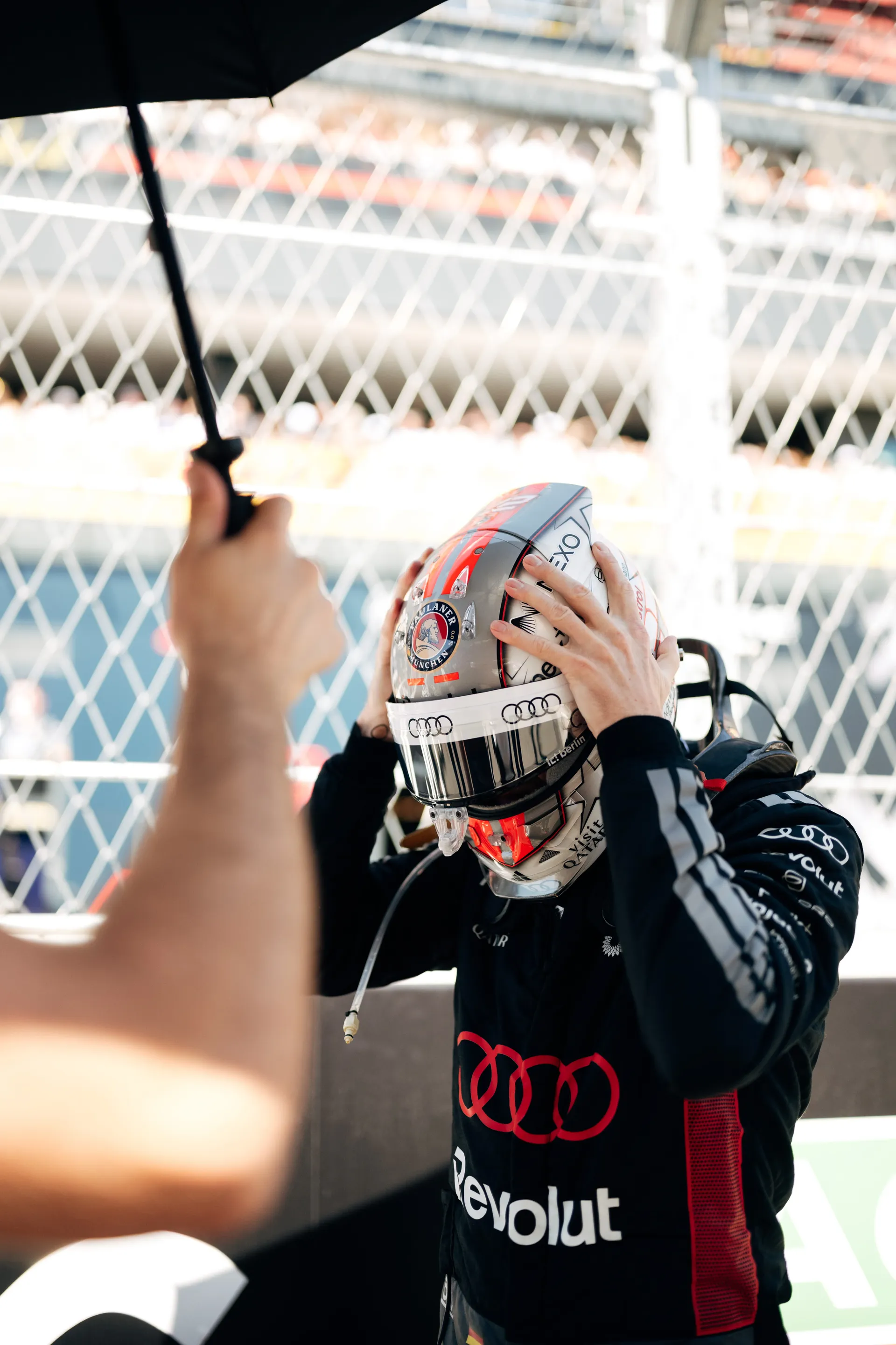 Nico Hulkenberg of the Audi Revolut F1® Team putting on his helmet on the grid in Madrid