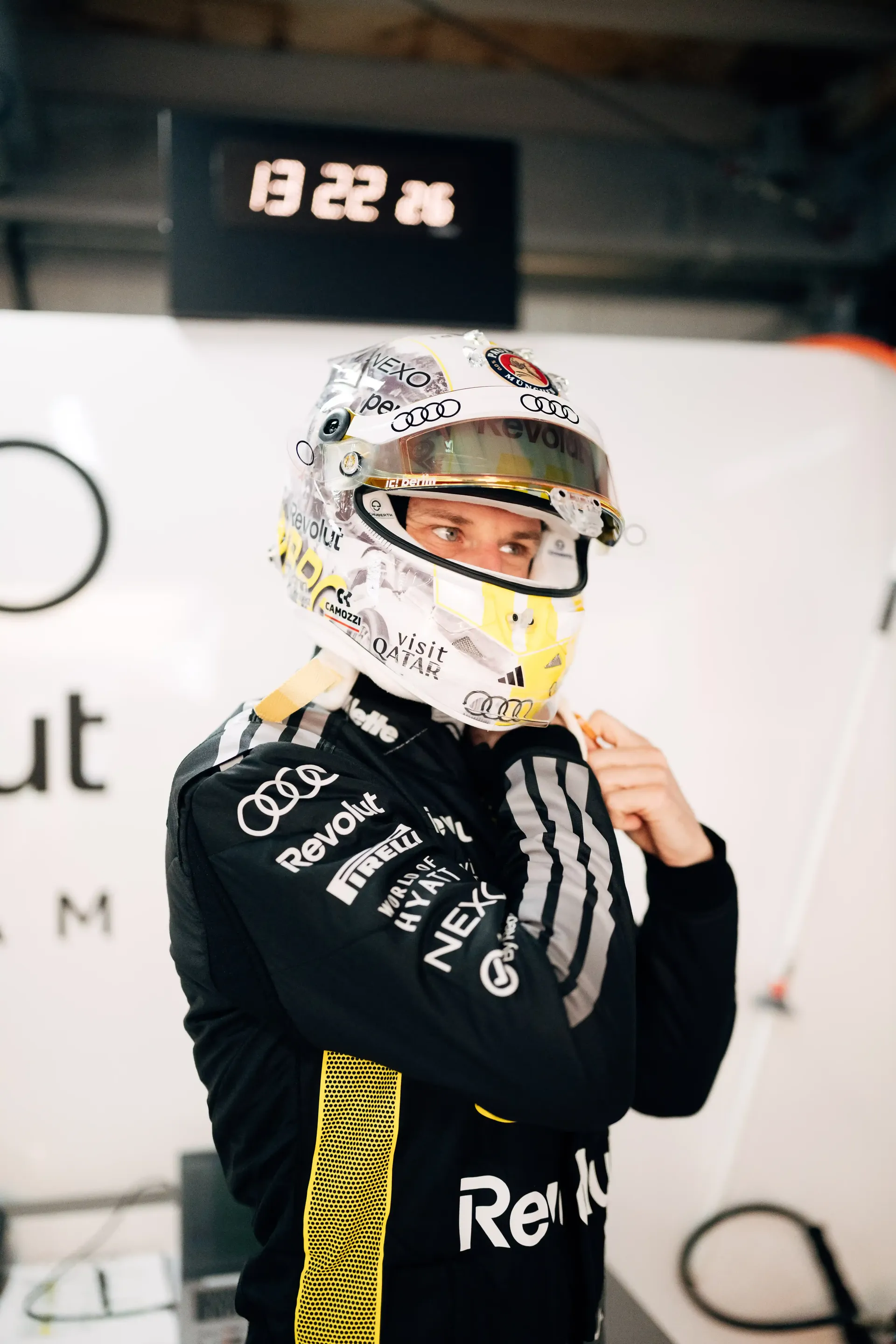 Niko Hulkenberg driver at Audi Revolut F1® Team adjusts helmet in the Monaco garage before FP1.
