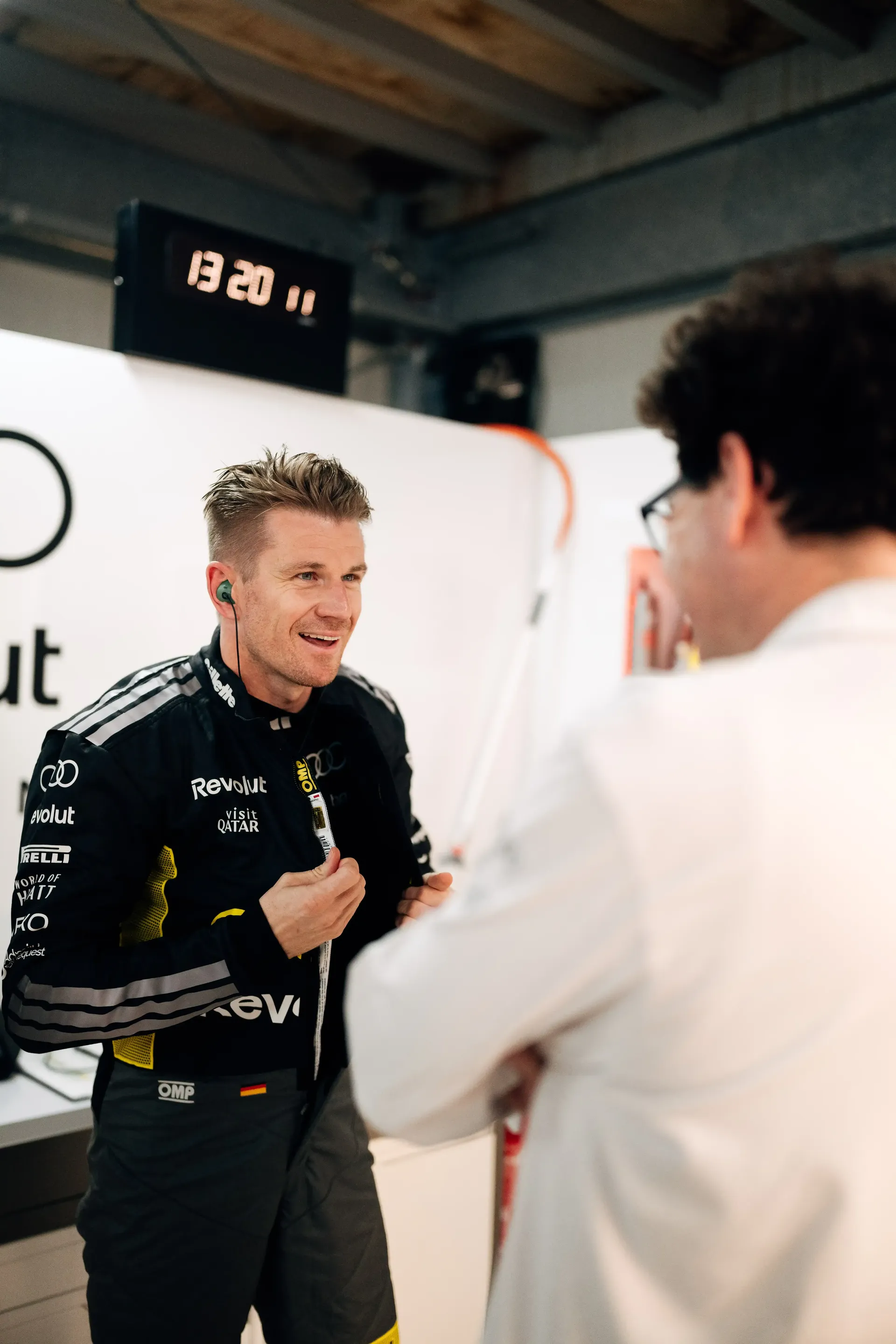 Nico Hulkenberg driver at the Audi Revolut F1® Team peaks with a Mattia Binotta in the Monaco garage ahead of FP1.