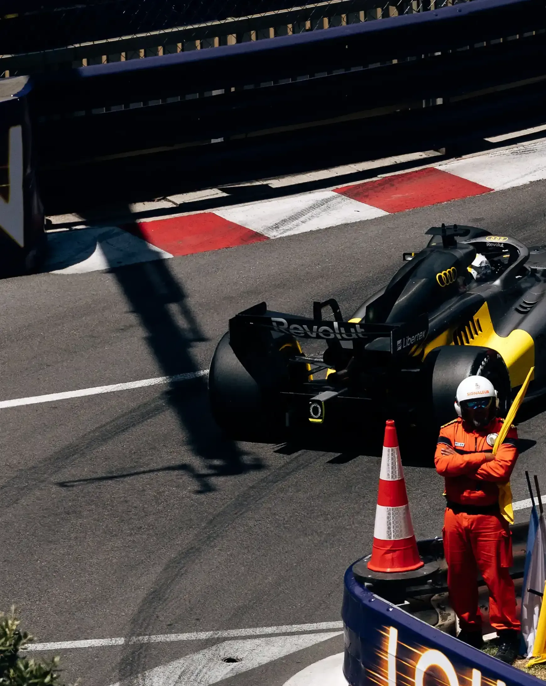 Audi Revolut F1® Team car R26 navigates a sharp Monaco street circuit corner during FP1.