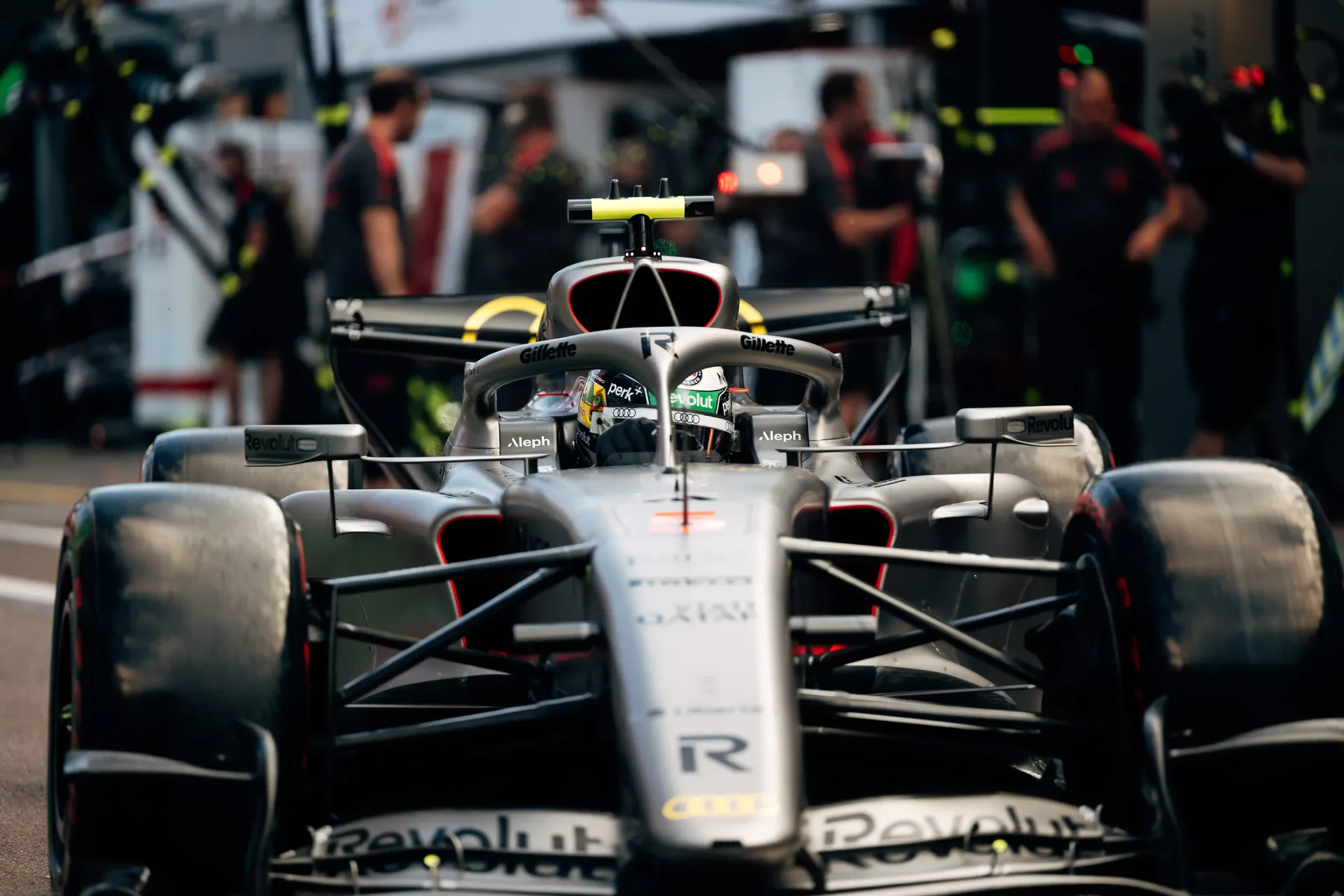 Front-on view of the Audi Revolut F1® Team Formula 1 car in the pit lane.