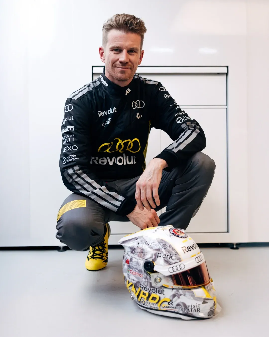 Nico Hulkenbergs in sitting pose in front of his new special edition Nuvolari helmet at the Monaco Grand Prix 2026