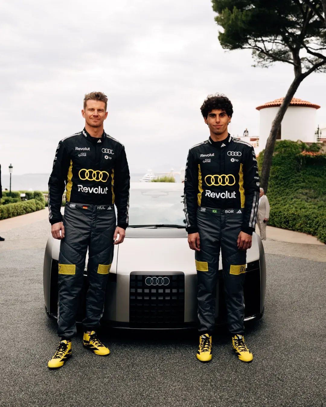 Nico Hulkenberg and Gabriel Bortoleto drivers at the Audi Revolut F1® Team posing in front of Audi Novulari at the release Event in Monaco at the GP weekend