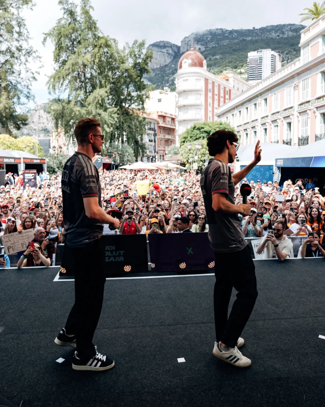 Gabriel Bortoleto and Nico Hülkenberg of the Audi Revolut F1® Team appear on stage during a fan forum event at the Monaco Grand Prix in Monte Carlo.