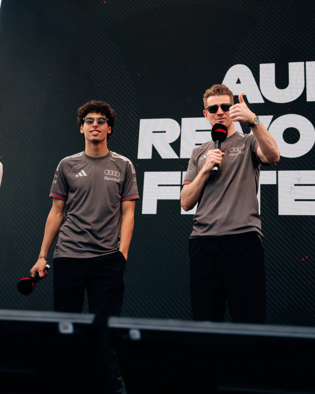Gabriel Bortoleto and Nico Hülkenberg address fans during an Audi Revolut F1® Team fan forum appearance at the Monaco Grand Prix weekend.