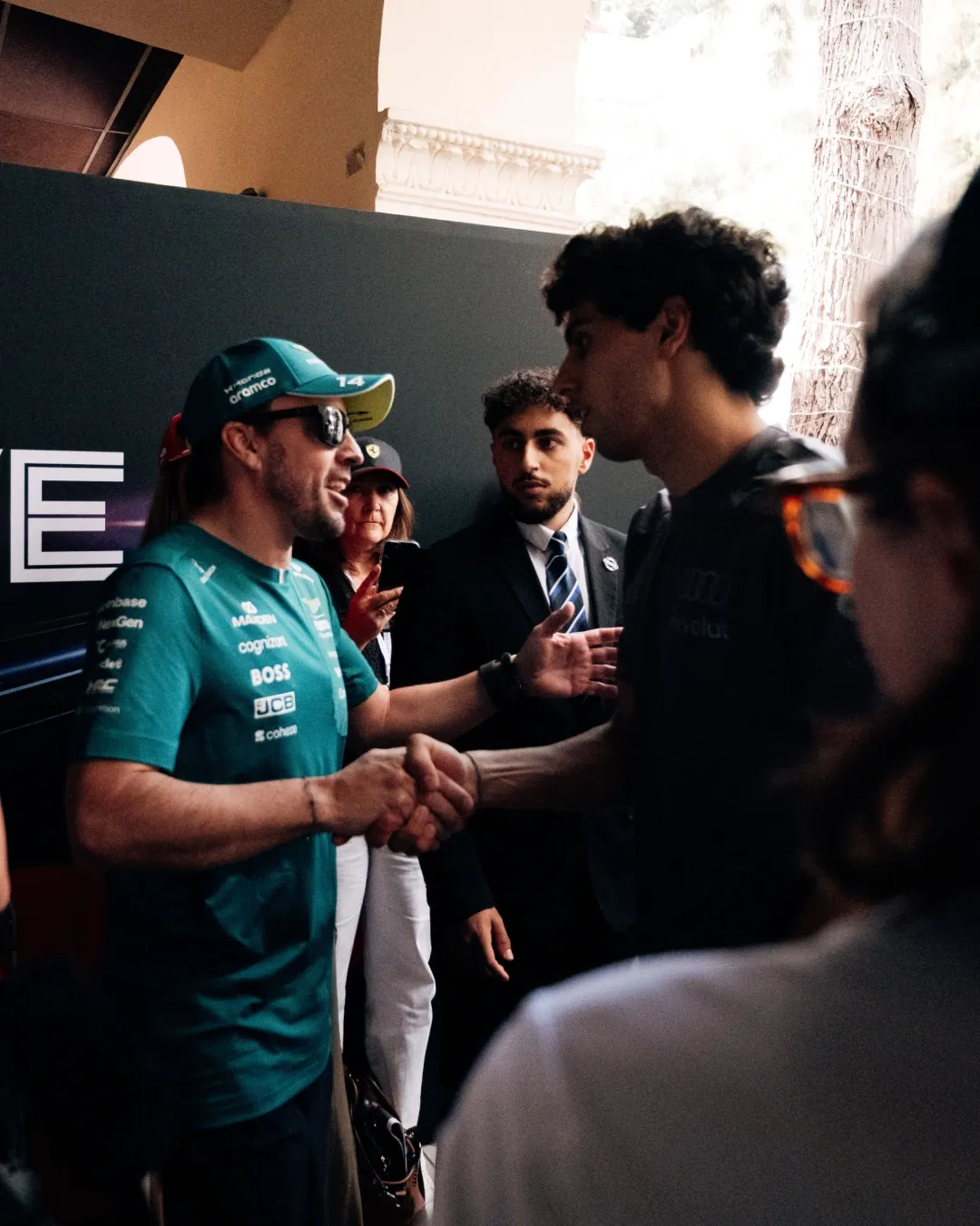Gabriel Bortoleto greets rivalry team driver backstage during an Audi Revolut F1® Team appearance at the Monaco Grand Prix weekend.
