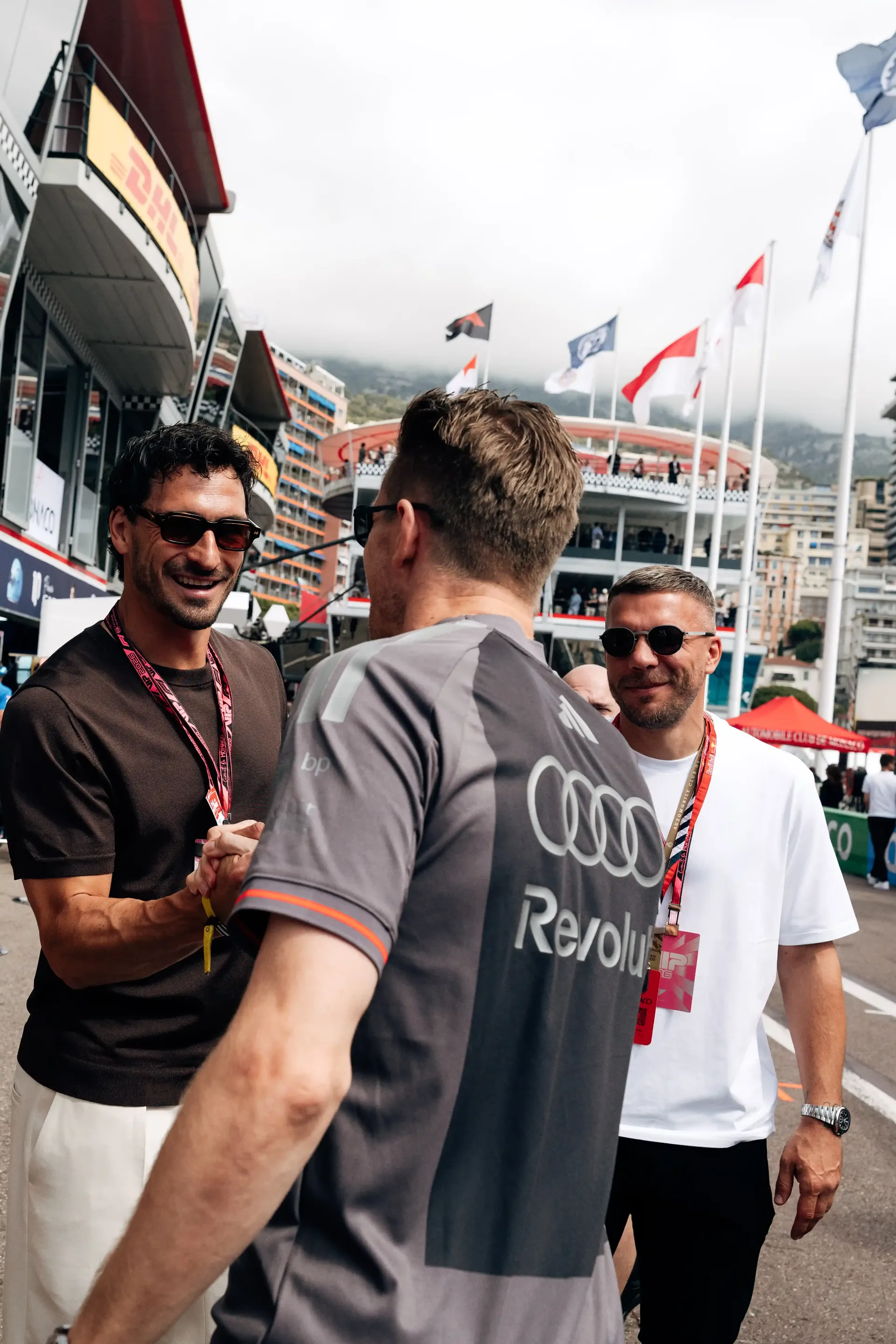 Nico Hülkenberg greets guests during a shirt swap event in the Monaco Grand Prix paddock.