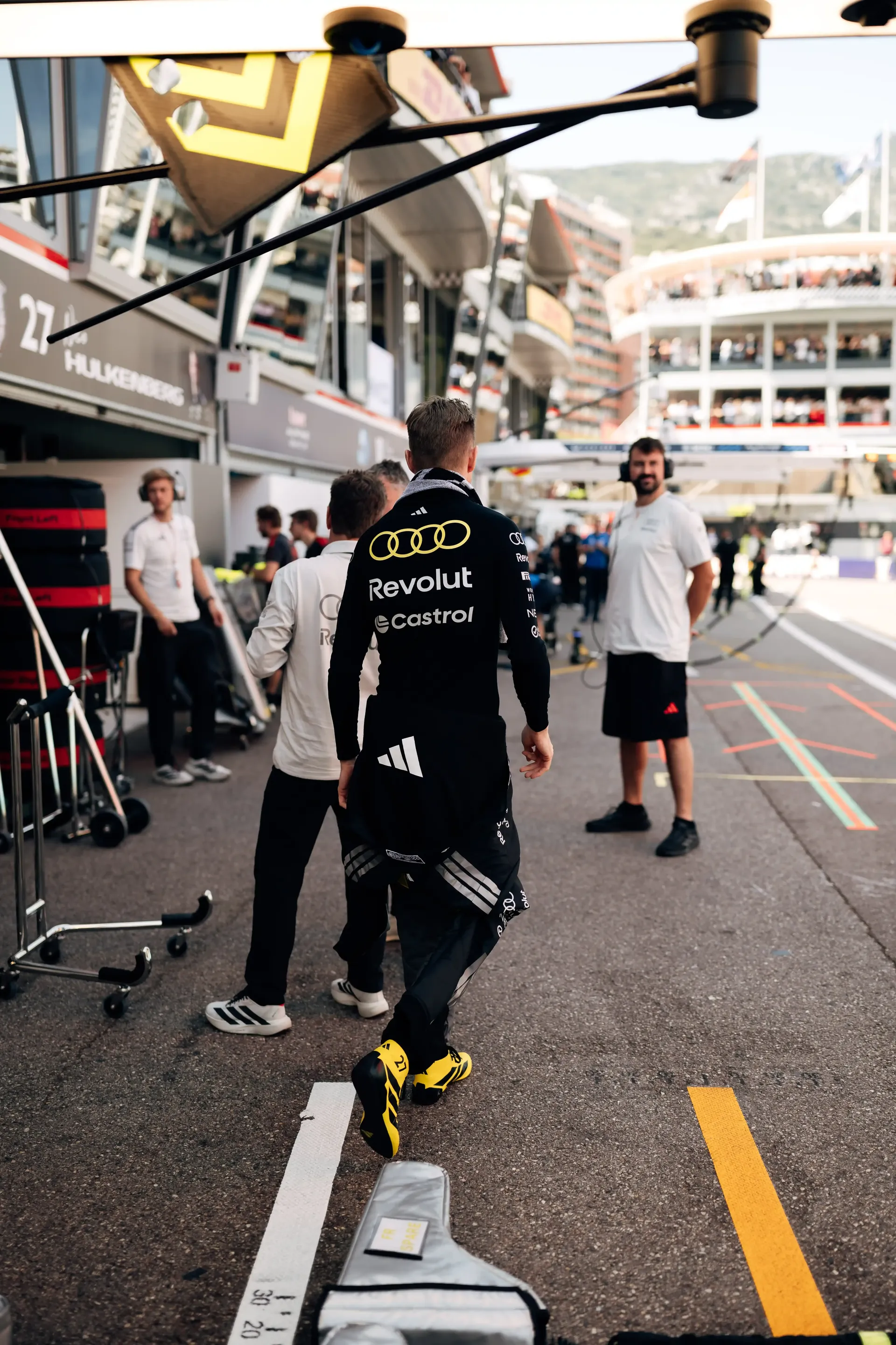 Audi Revolut F1® Team driver Nico Hulkenberg walks through the pit lane in Monaco ahead of the qualifying session.