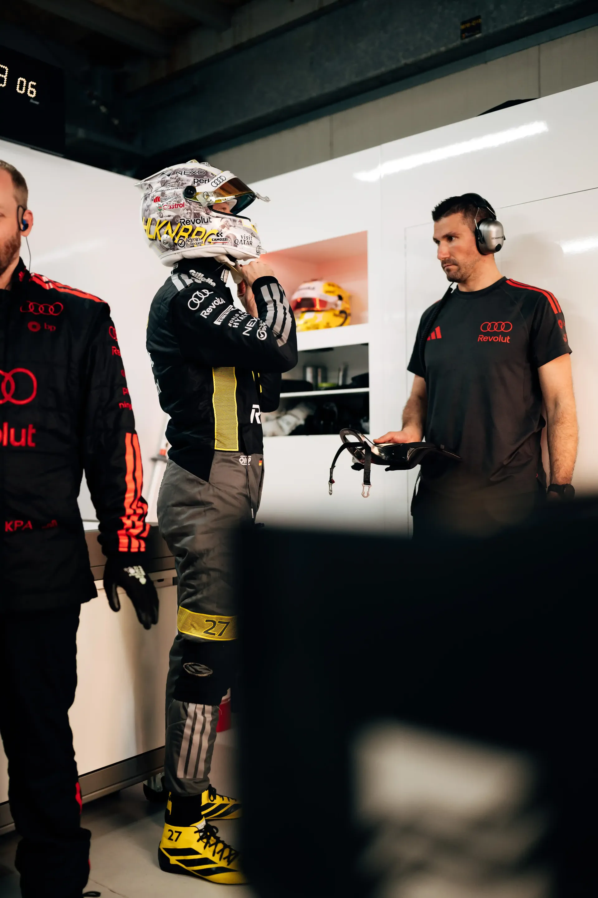 Audi Revolut F1® Team driver Nico Hulkenberg speaks with team personnel inside the garage before qualifying.