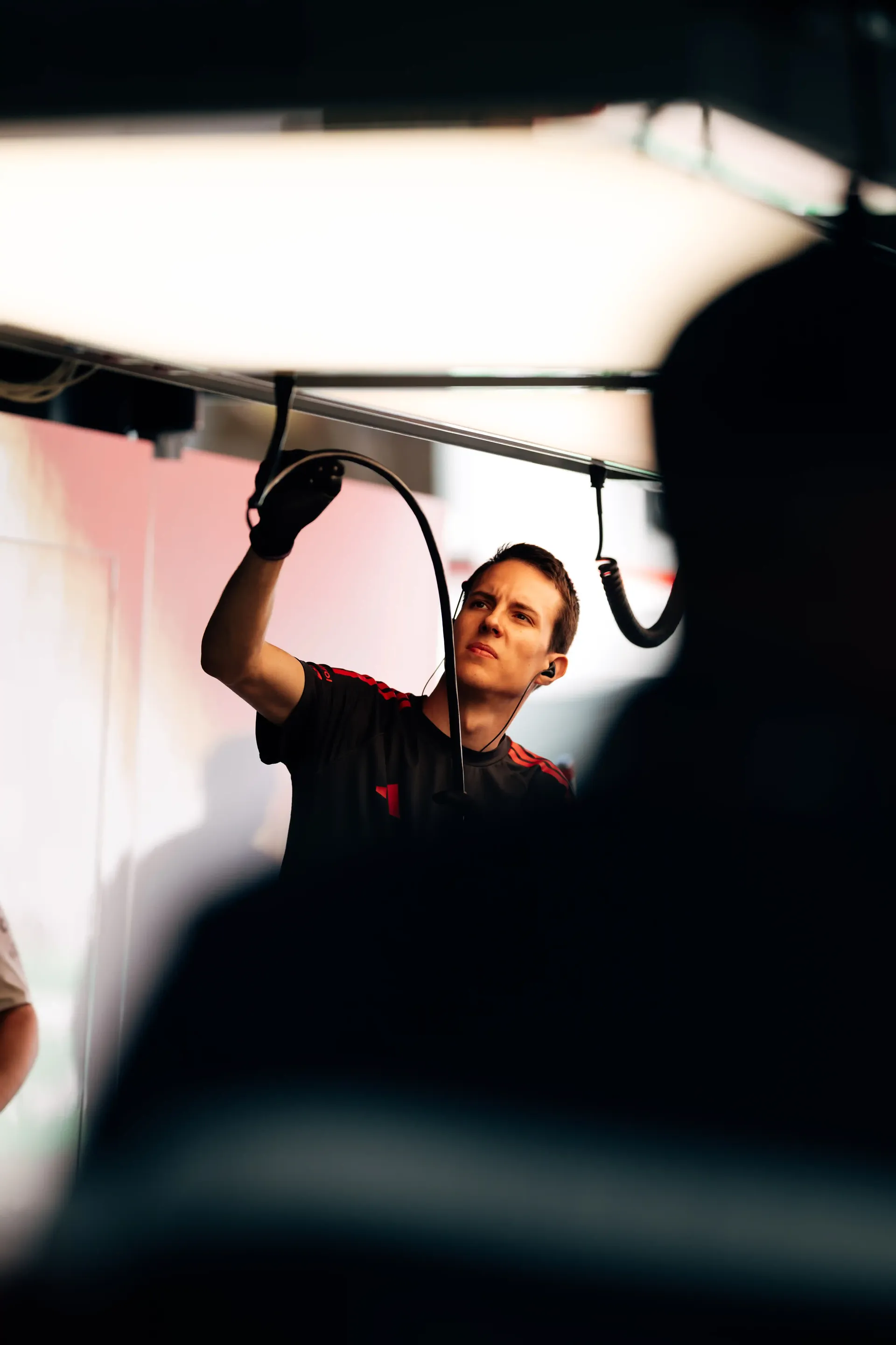 Audi Revolut F1® Team mechanic prepares equipment inside the garage before the session.