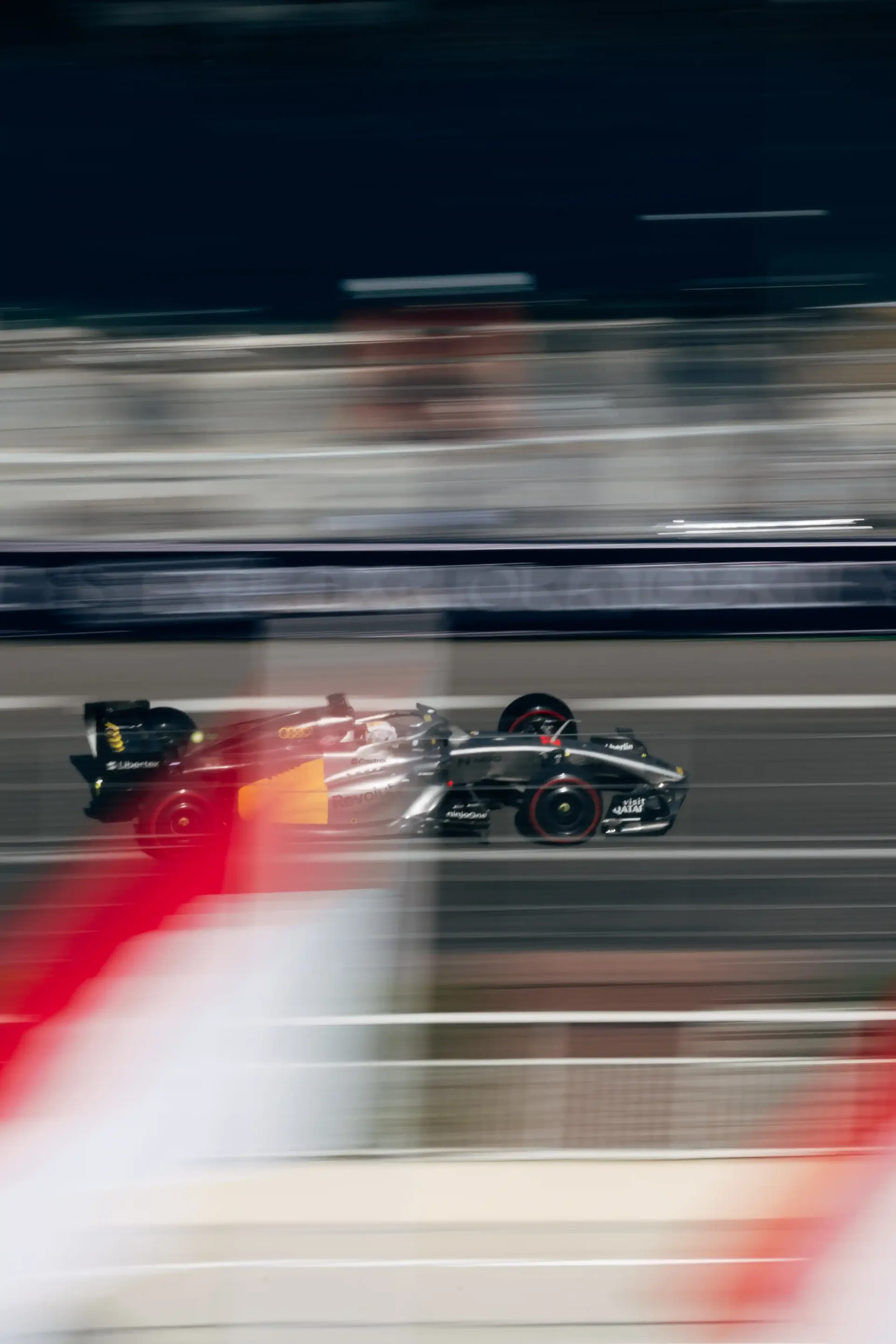 Audi Revolut F1® Team race car speeds through Monaco in a dynamic motion-blur shot during qualifying.