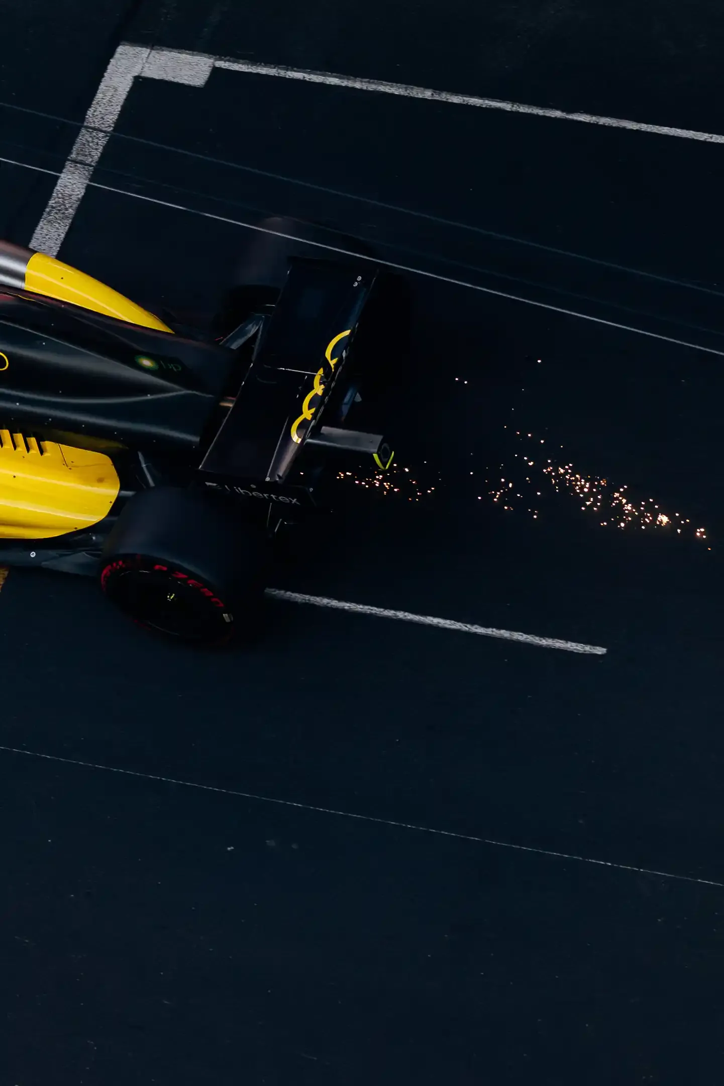 Overhead detail of the Audi Revolut F1® Team race car R26 on track with sparks visible during Monaco Grand Prix qualifying.