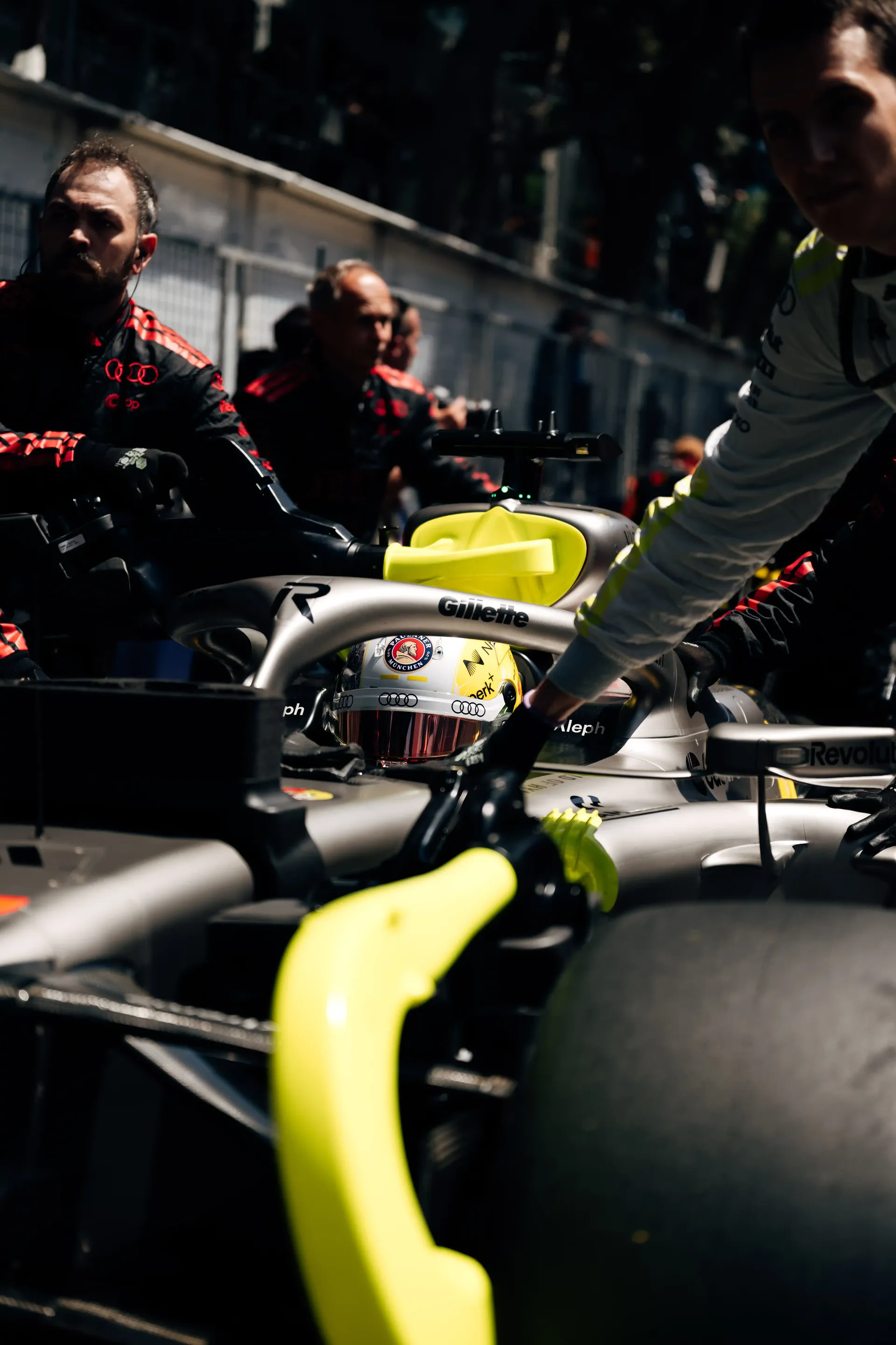 Close-up of the Audi Revolut F1® Team car R26 on the Monaco Grand Prix grid surrounded by team personnel.