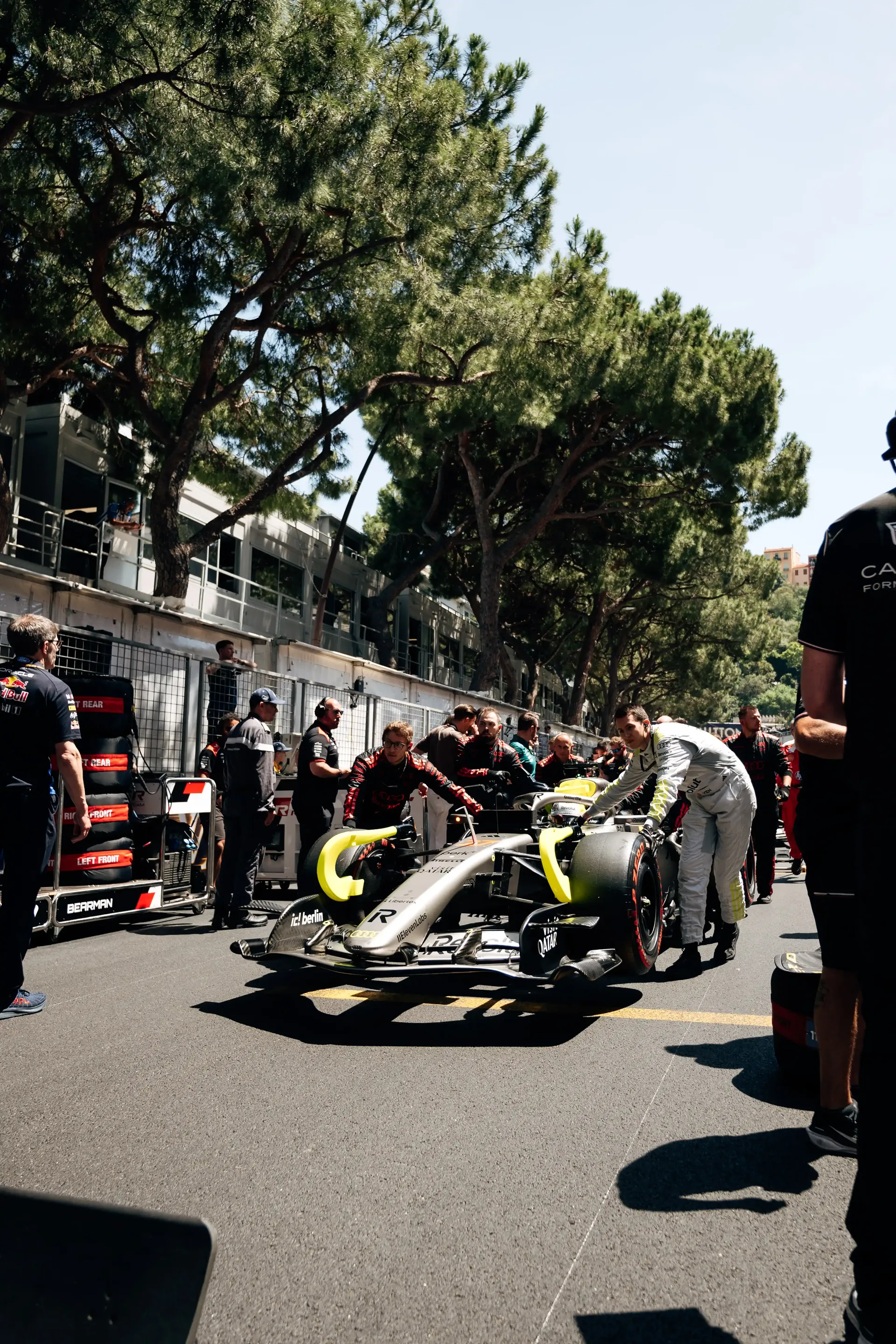 Audi Revolut F1® Team crew members prepare car R26 on the Monaco Grand Prix starting grid.