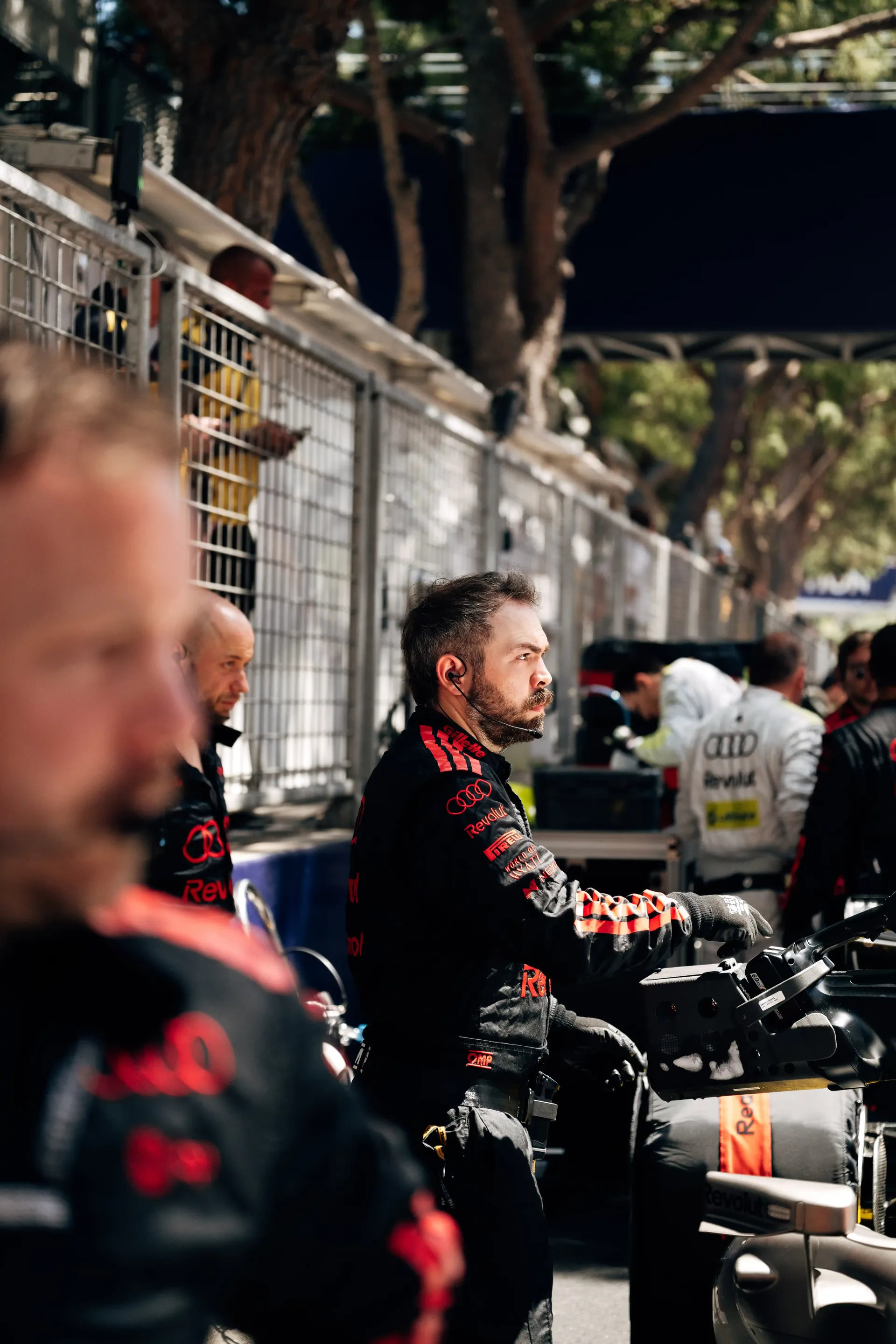Audi Revolut F1® Team personnel monitor pre-race preparations on the Monaco Grand Prix grid.