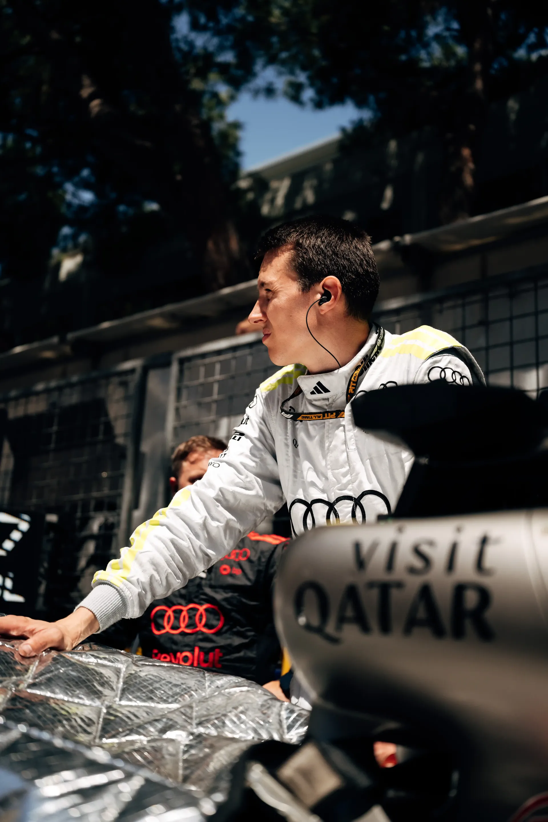 Audi Revolut F1® Team mechanic stands beside car R26 on the Monaco Grand Prix grid before the race.
