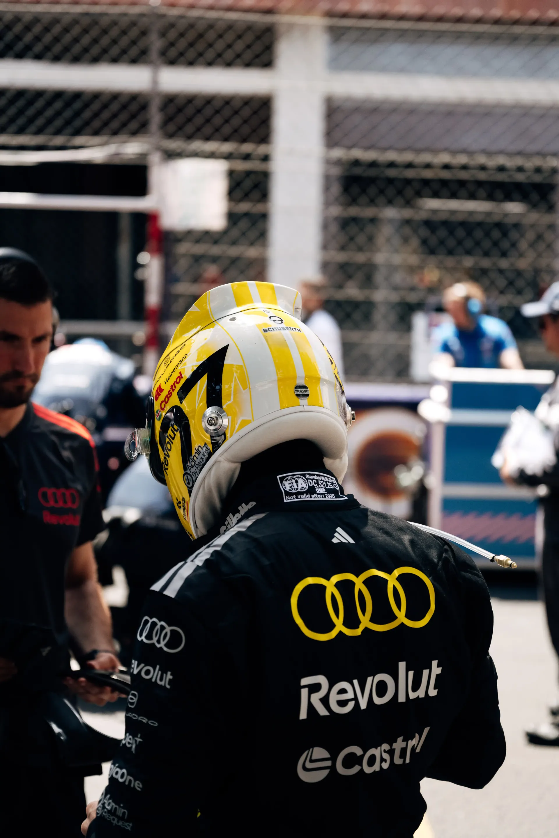 Rear view of an Audi Revolut F1® Team driver Nico Hulkenberg in race gear on the Monaco Grand Prix grid.