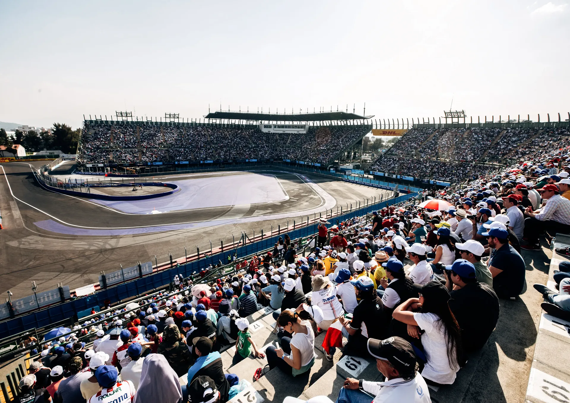 Empty stadium section of the track with red and white kerbs ahead of the Mexico City Grand Prix
