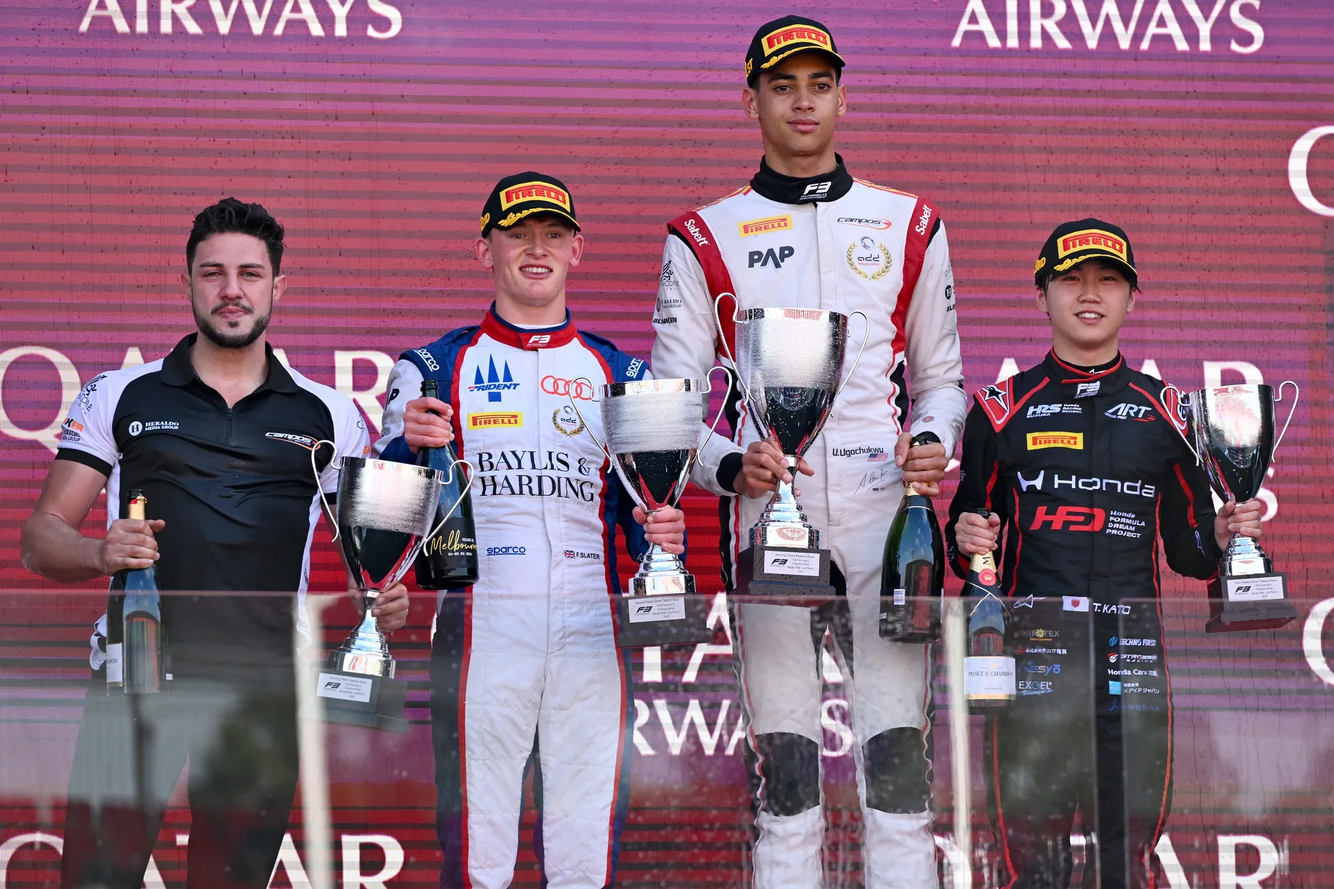 Freddie Slater on the podium holding a trophy after a Formula 3 race as part of the Audi Revolut F1® Team Driver Development Program