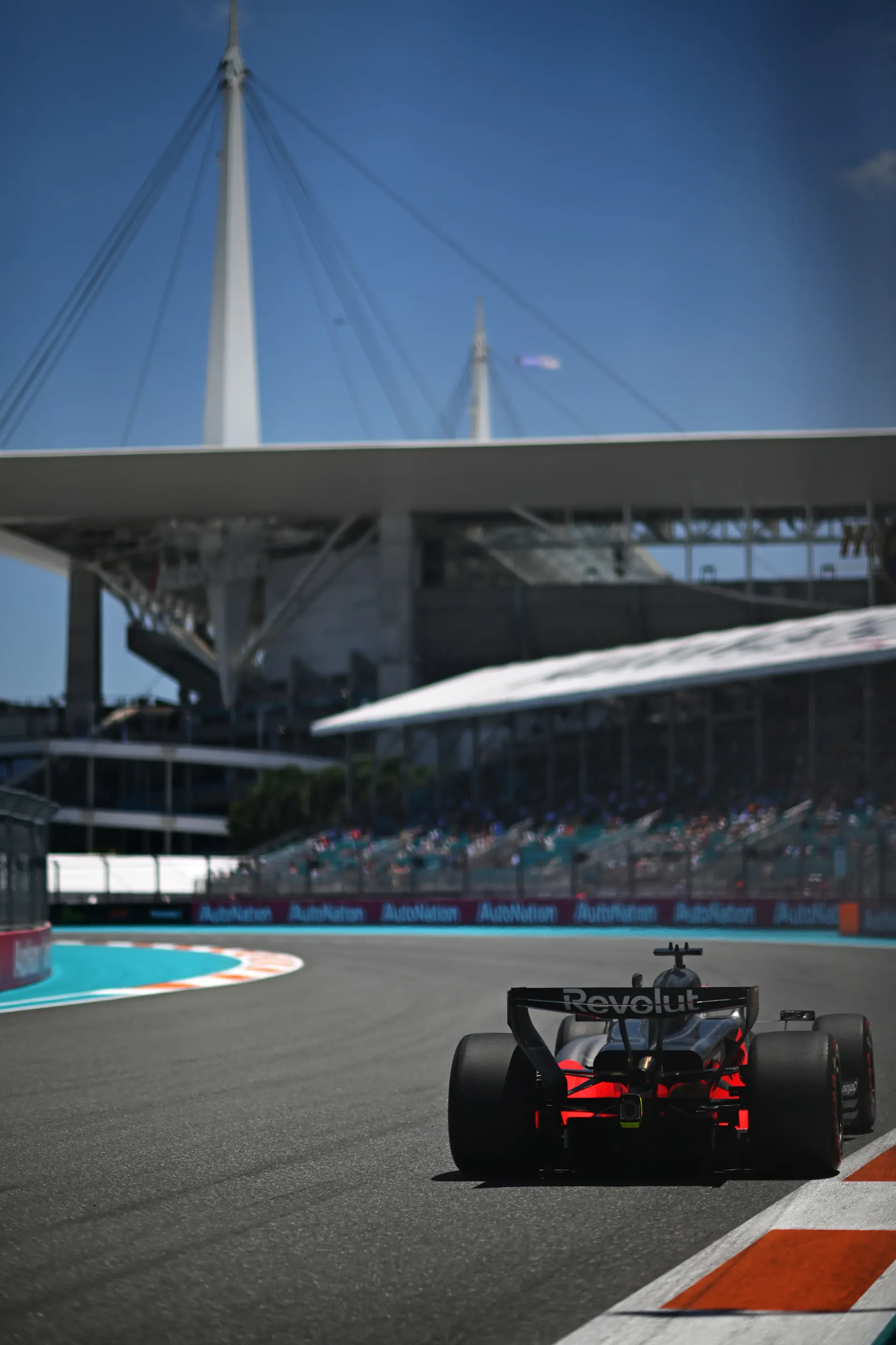 Rear view of Audi Revolut F1® Team car accelerating out of corner at Miami Grand Prix circuit