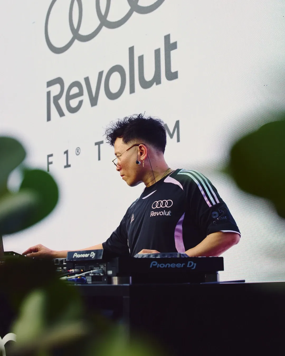 DJ performing in Audi Revolut F1® Team branding during the MAPS Backlot off track activation in Miami.