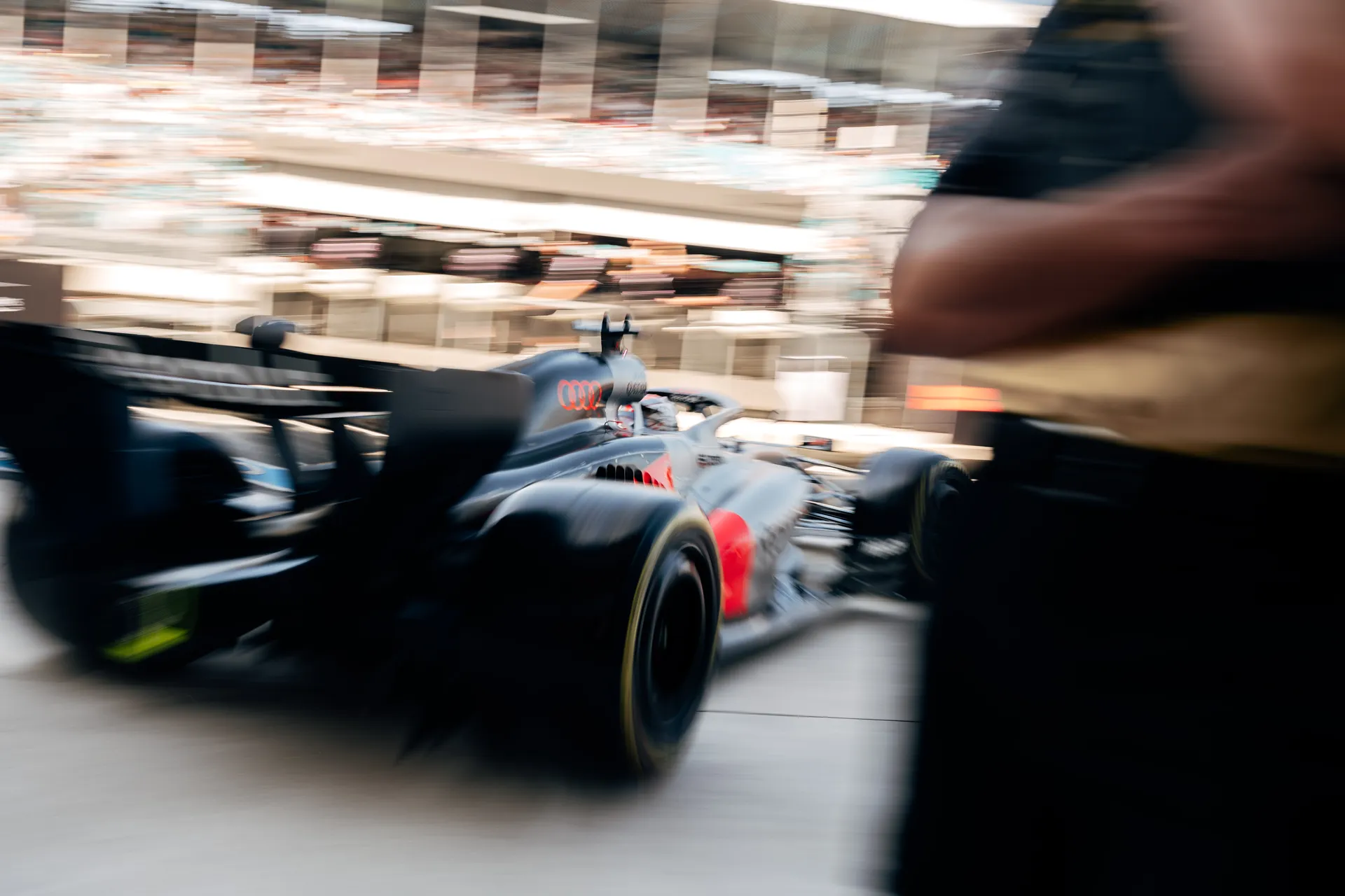 Motion blur shot of the Audi Revolut F1® Team Formula 1 car moving through the pit lane during the Miami race weekend.