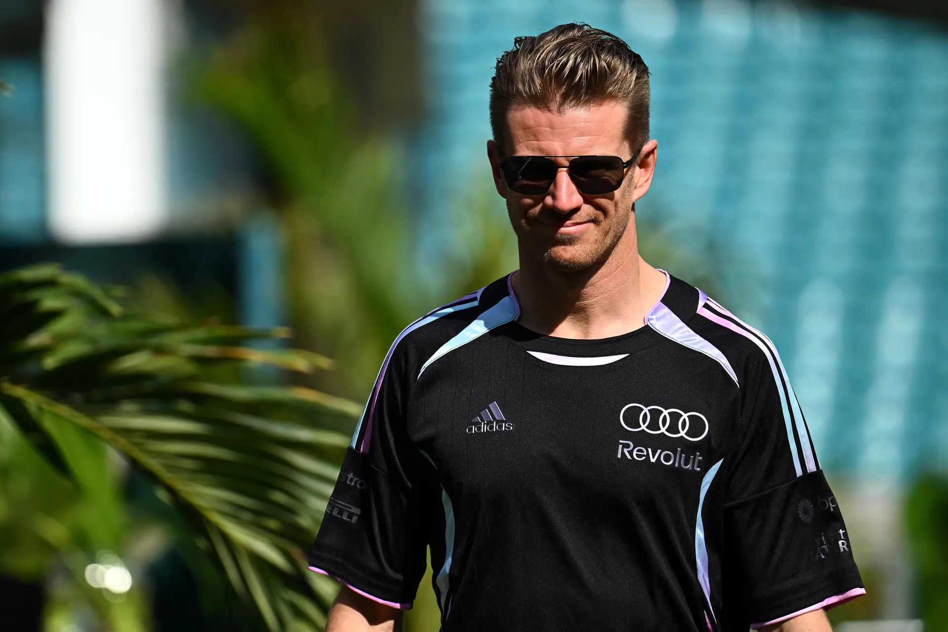 Nico Hulkenberg walking in Audi Revolut F1® Team kit wearing sunglasses during Miami Grand Prix